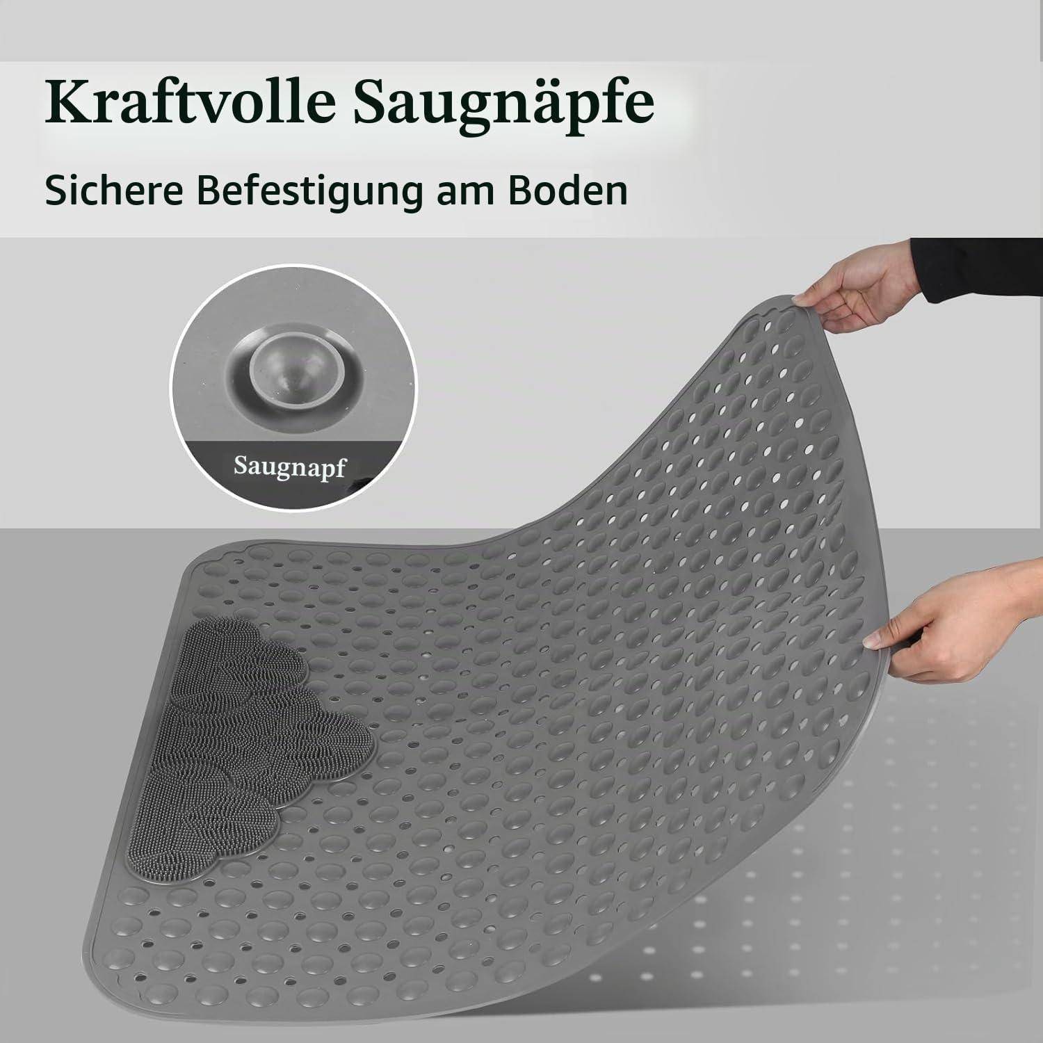 Graue perforierte rutschfeste Matte mit Saugnäpfen, wird von zwei Händen angehoben gezeigt; deutscher Text lautet "Kraftvolle Saugnäpfe"" und ""Sichere Befestigung am Boden"".