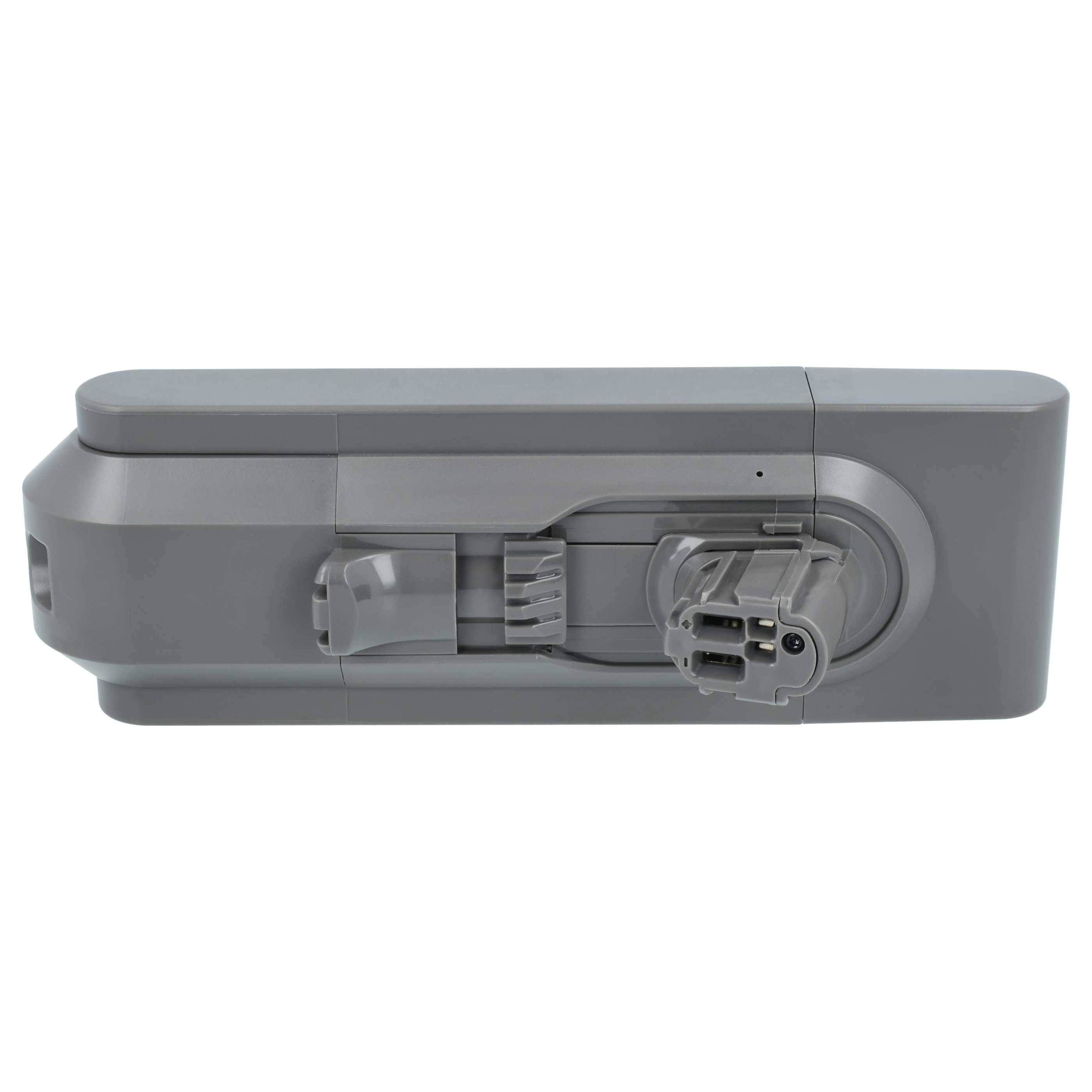 Graues rechteckiges Batteriepack mit seitlich montiertem Anschluss und Verriegelungsmechanismus auf weißem Hintergrund.