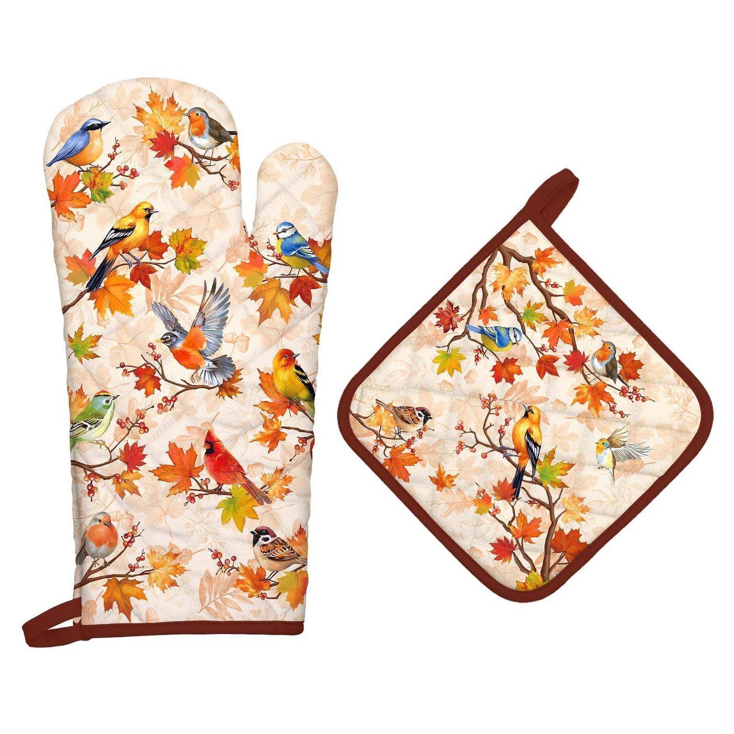 Gesteppte Herbst-Vogelmuster-Ofenhandschuh und passender Topflappen mit braunem Rand, gezeigt auf weißem Hintergrund.