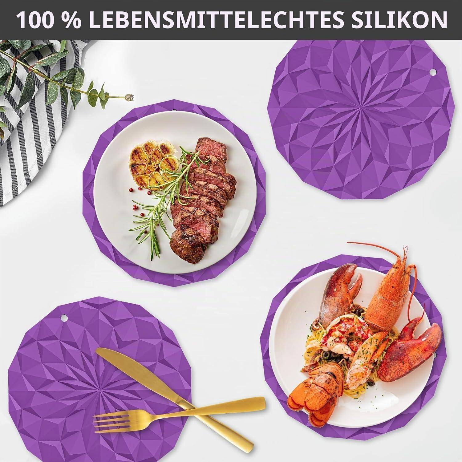 Werbebild von violetten Silikonunterlagen und Topfuntersetzern unter Tellern mit Steak und Hummer, mit Text „100 % LEBENSMITTELECHT SILIKON