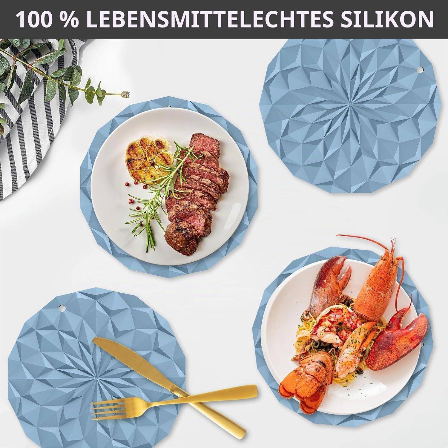 Werbebild von blauen, facettierten Silikonuntersetzer unter Tellern mit Steak und Hummer, mit deutschem Text 