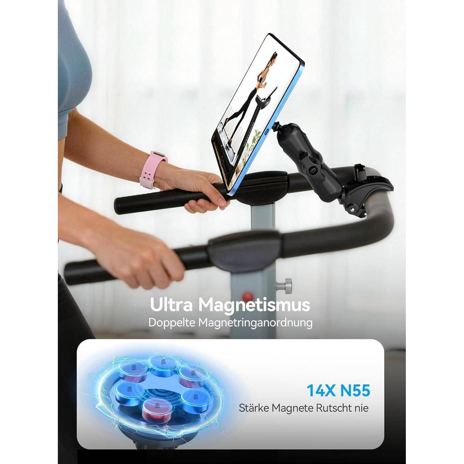 Person nutzt ein Tablet-gesteuertes Heimtrainer mit Magnetbremse; der Anzeigentext lautet „Ultra-Magnetismus", „Doppelte Magnetringanordnung"", „14X N55"", „Starke Magnete rutschen nie"".