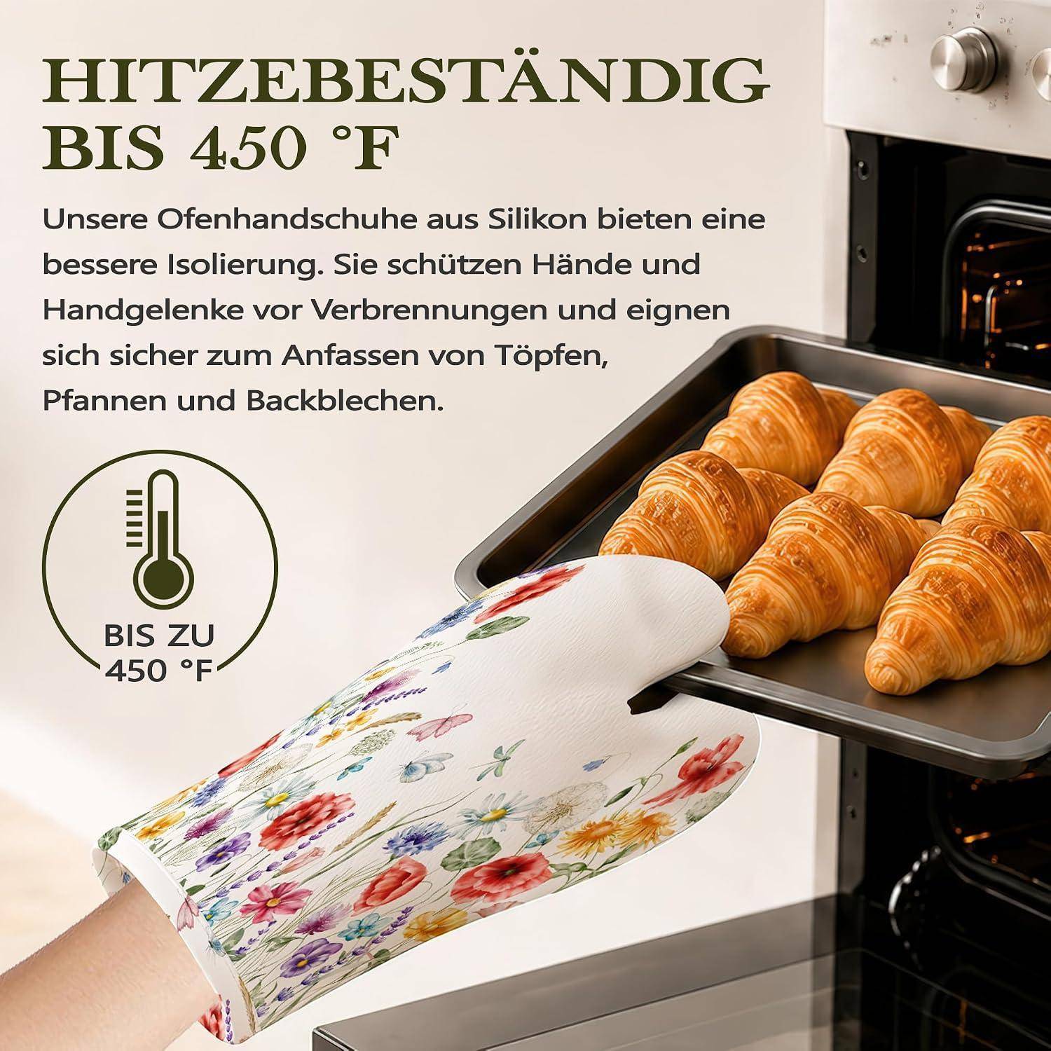 Werbeanzeige zeigt einen hitzebeständigen Blumenmuster-Silikon-Ofenhandschuh, der ein heißes Backblech mit Croissants aus dem Ofen hält; deutscher Text besagt hitzebeständig bis 450°F.