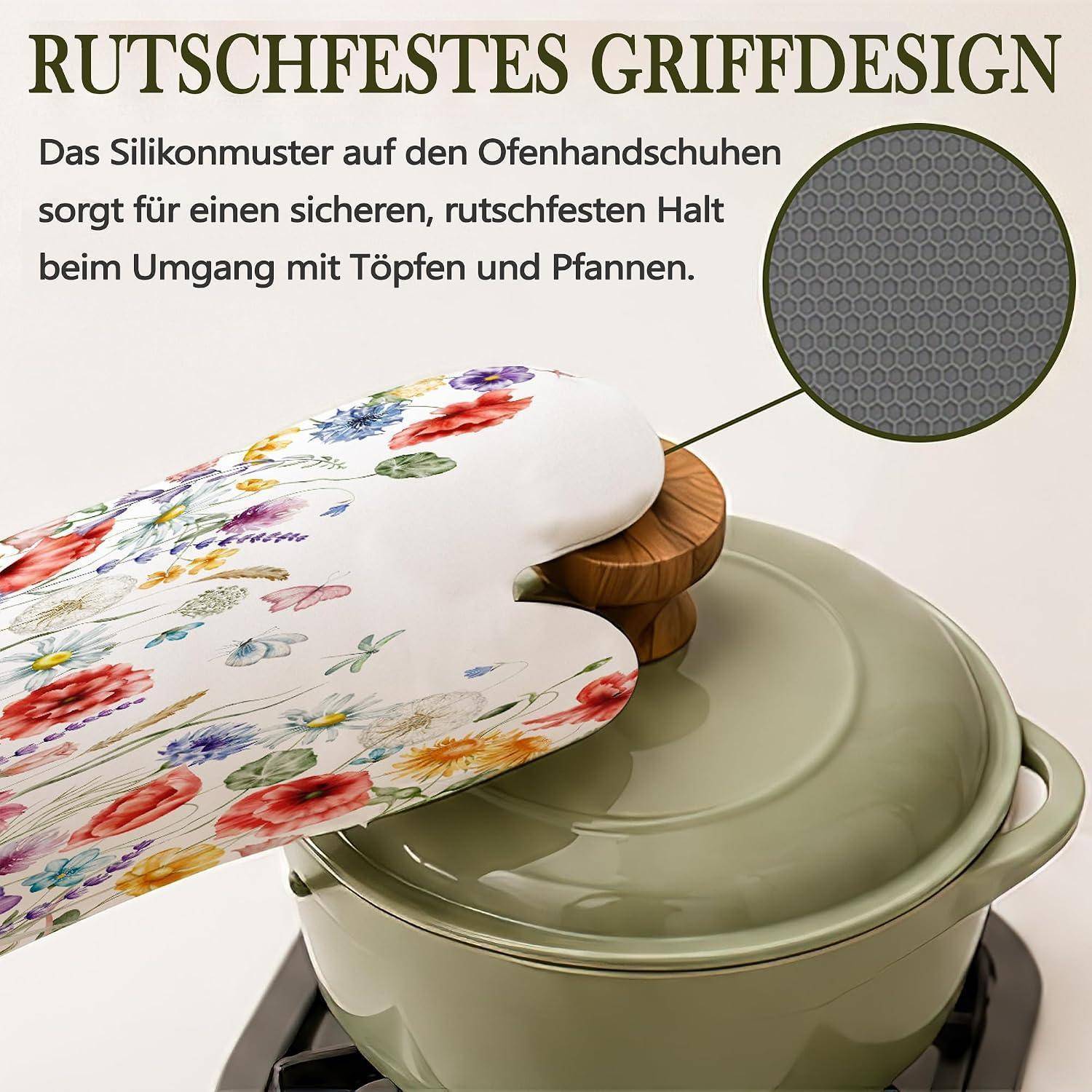 Blumiges Ofenhandschuh, der einen Topfdeckel greift, mit einer Nahaufnahme, die das Silikonmuster für einen sicheren, rutschfesten Halt zeigt.