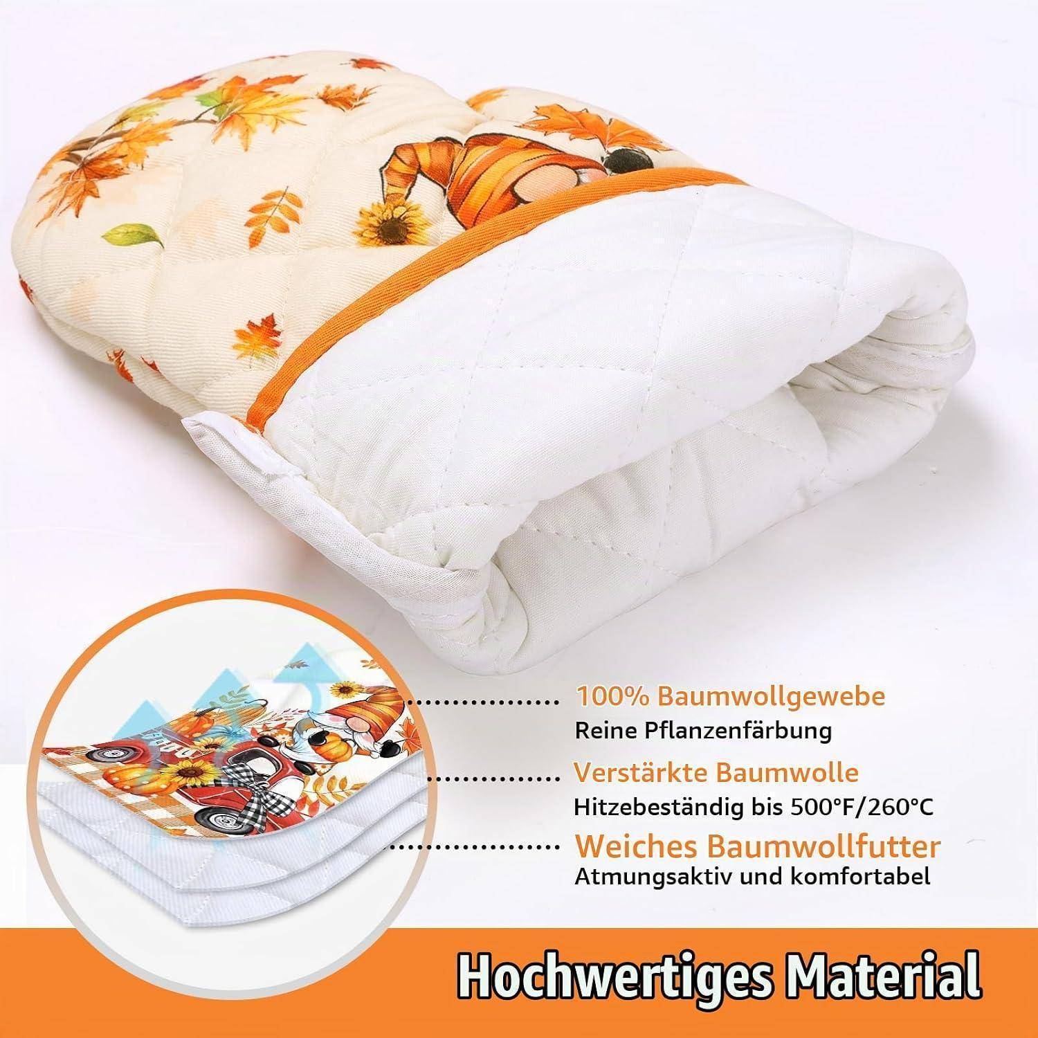 Gefaltete weiße Steppdecke mit orangefloralem Muster und deutschem Text, der hochwertige Materialien hervorhebt: 100% Baumwolle, verstärkte Baumwolle, hitzebeständig, weiches Baumwollvlies, atmungsaktiv.