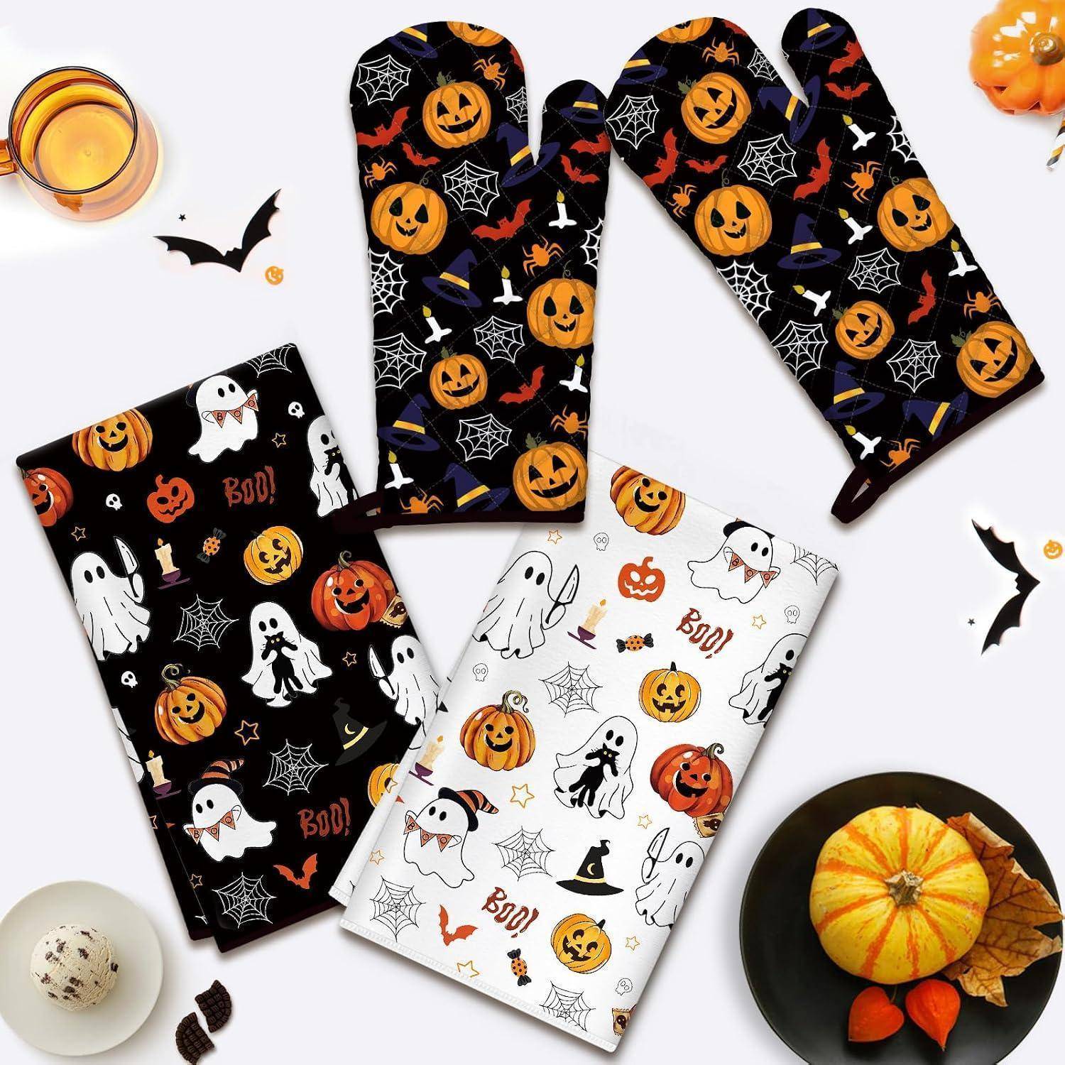 Vier gefaltete Halloween-Pyjamahosen in Schwarz, Weiß und Kürbisdruck-Mustern mit Geistern, Fledermäusen, Spinnen und 