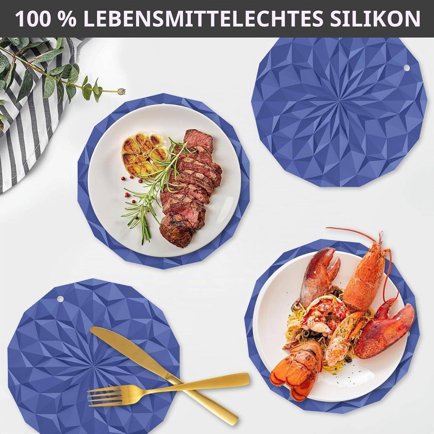 Werbebild von blauen facettierten Silikonuntersetzer unter Tellern mit Steak und Hummer, gekennzeichnet mit „100 % LEBENSMITTELECHTES SILIKON