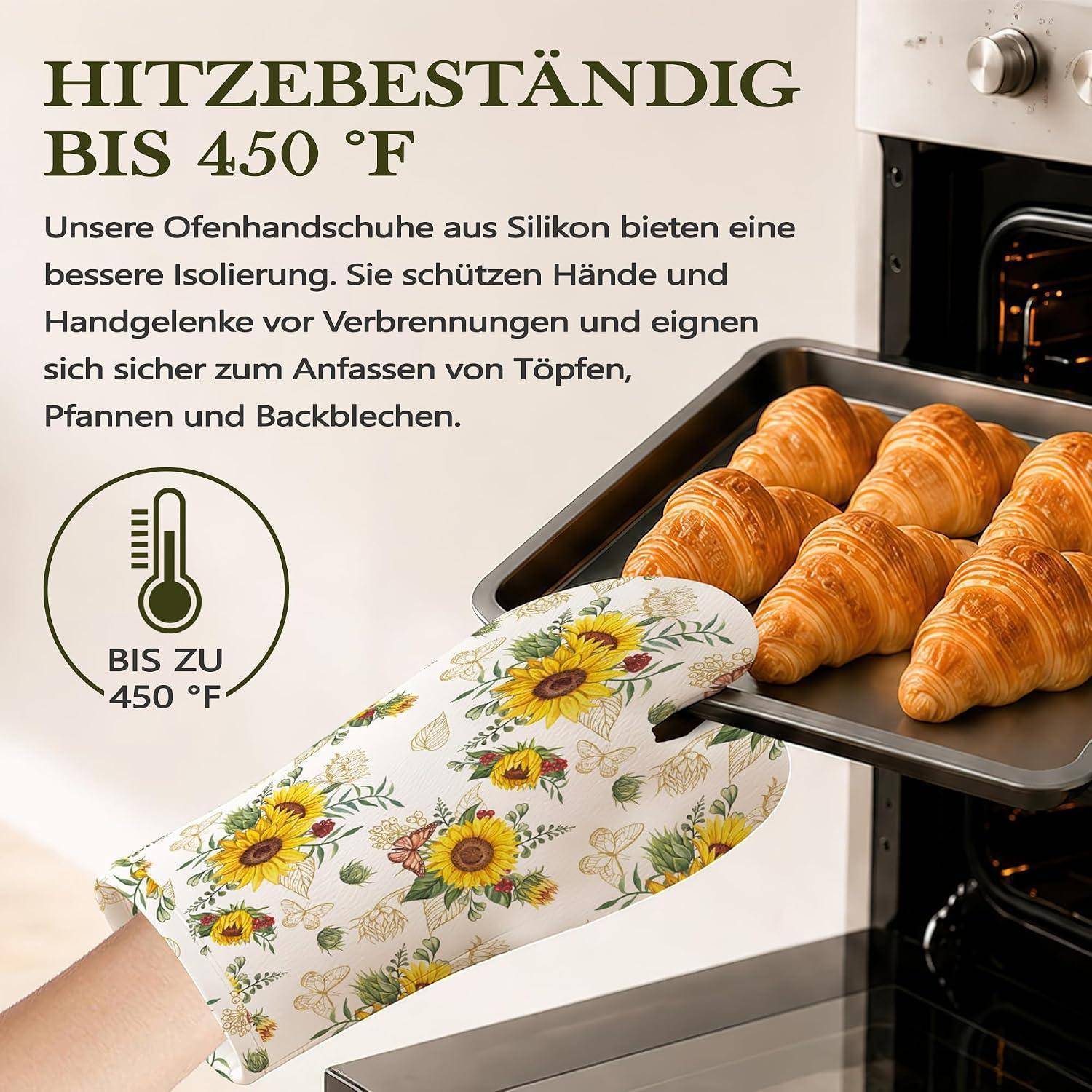 Deutsches Werbeanzeige mit floralen Silikon-Ofenhandschuhen, die ein Blech mit Croissants aus dem Ofen nehmen; der Text besagt, dass sie hitzebeständig bis 450°F sind und bessere Isolierung bieten.