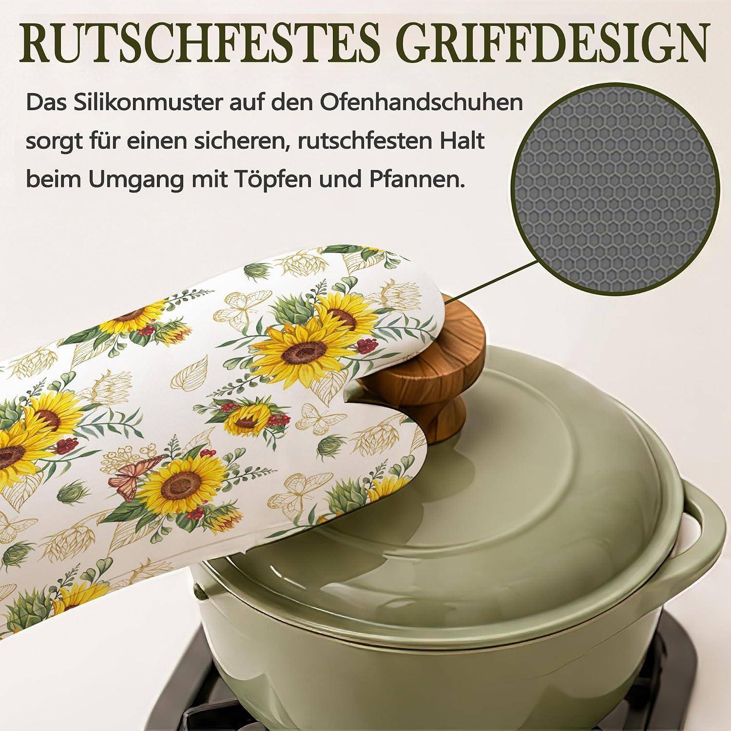 Deutschanzeige, die ein Ofenhandschuh mit Sonnenblumendruck zeigt, der einen Topfdeckel greift; eine Einblendung hebt die rutschfeste Silikongriffoberfläche hervor.
