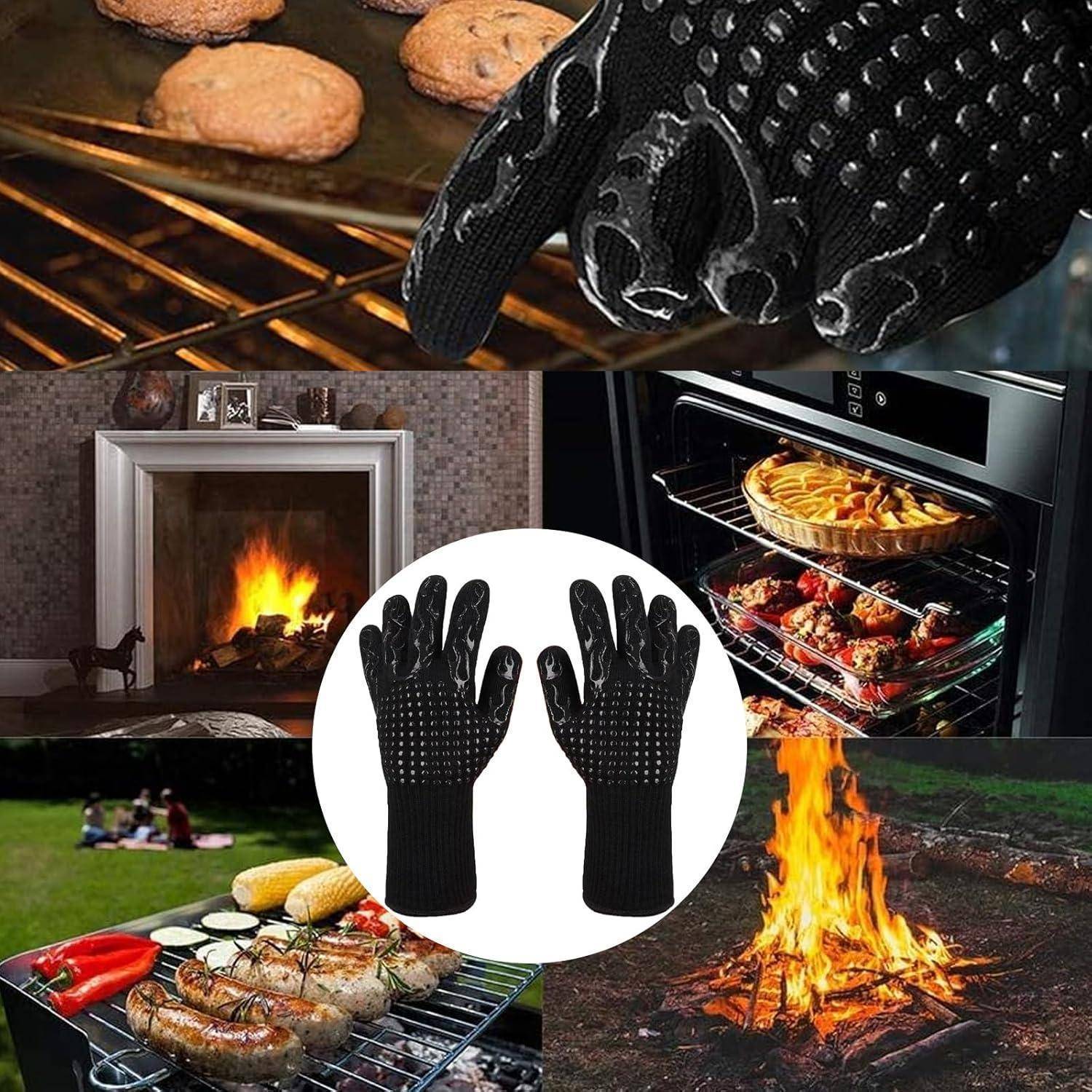 Schwarze hitzebeständige Handschuhe, die bei der Handhabung heißer Gegenstände aus einem Ofen, Kamin, Grill und Lagerfeuer verwendet werden.