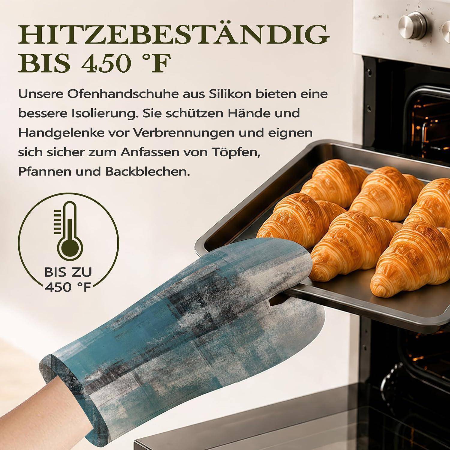 Deutsche Anzeige zeigt Ofenhandschuhe, die Hitze bis zu 450°F widerstehen, mit einer behandschuhten Hand, die Croissants aus einem Ofenblech entnimmt.