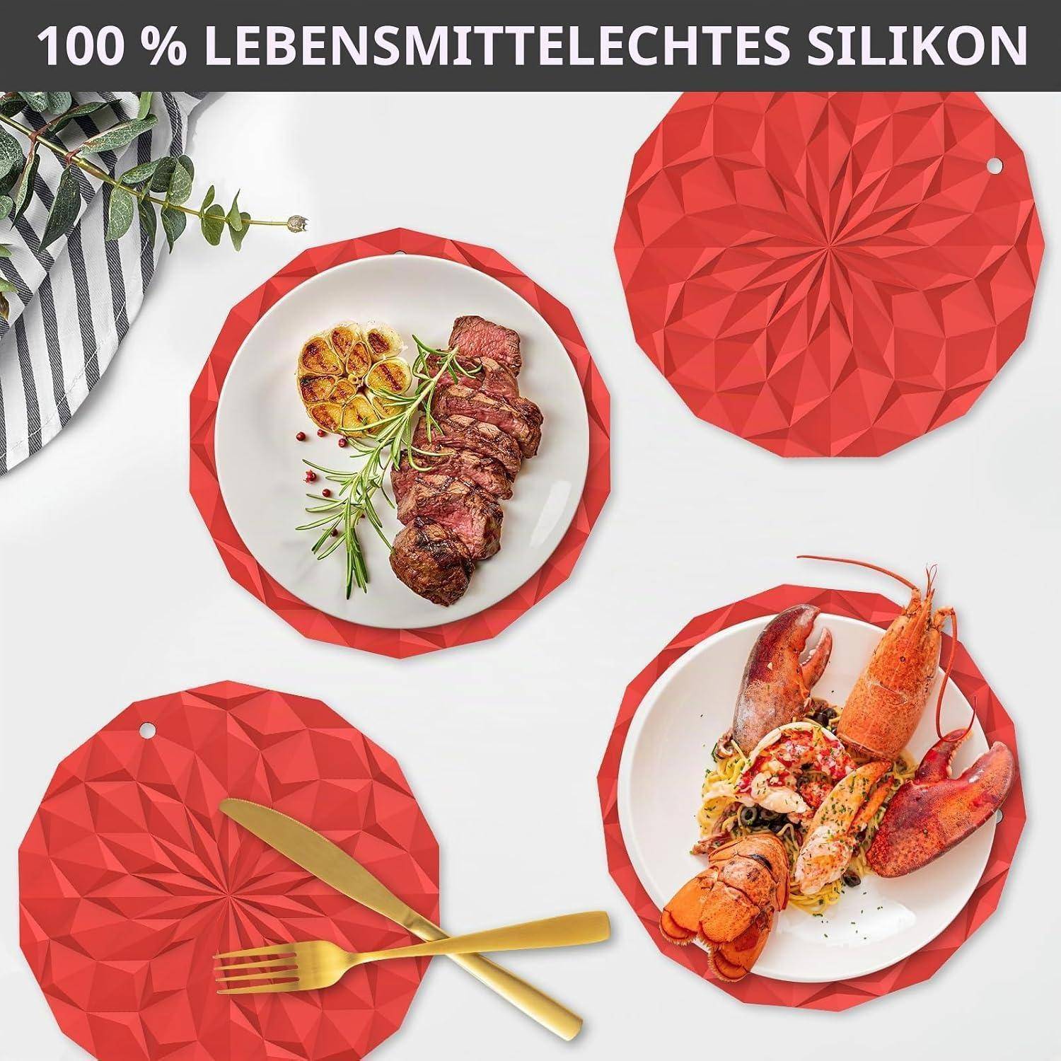 Werbebild von roten facettierten Silikonuntersetzern und Deckeln um Teller mit Steak und Hummer herum, mit deutschem Text „100 % lebensmittelechtes Silikon