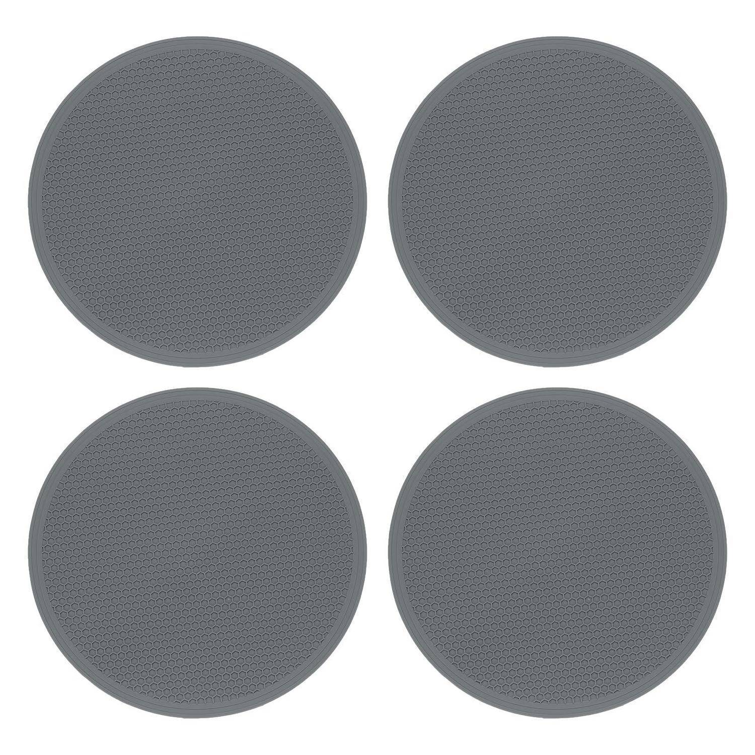 Vier graue kreisförmige strukturierte Pads, die in einem 2x2-Gitter auf weißem Hintergrund angeordnet sind.