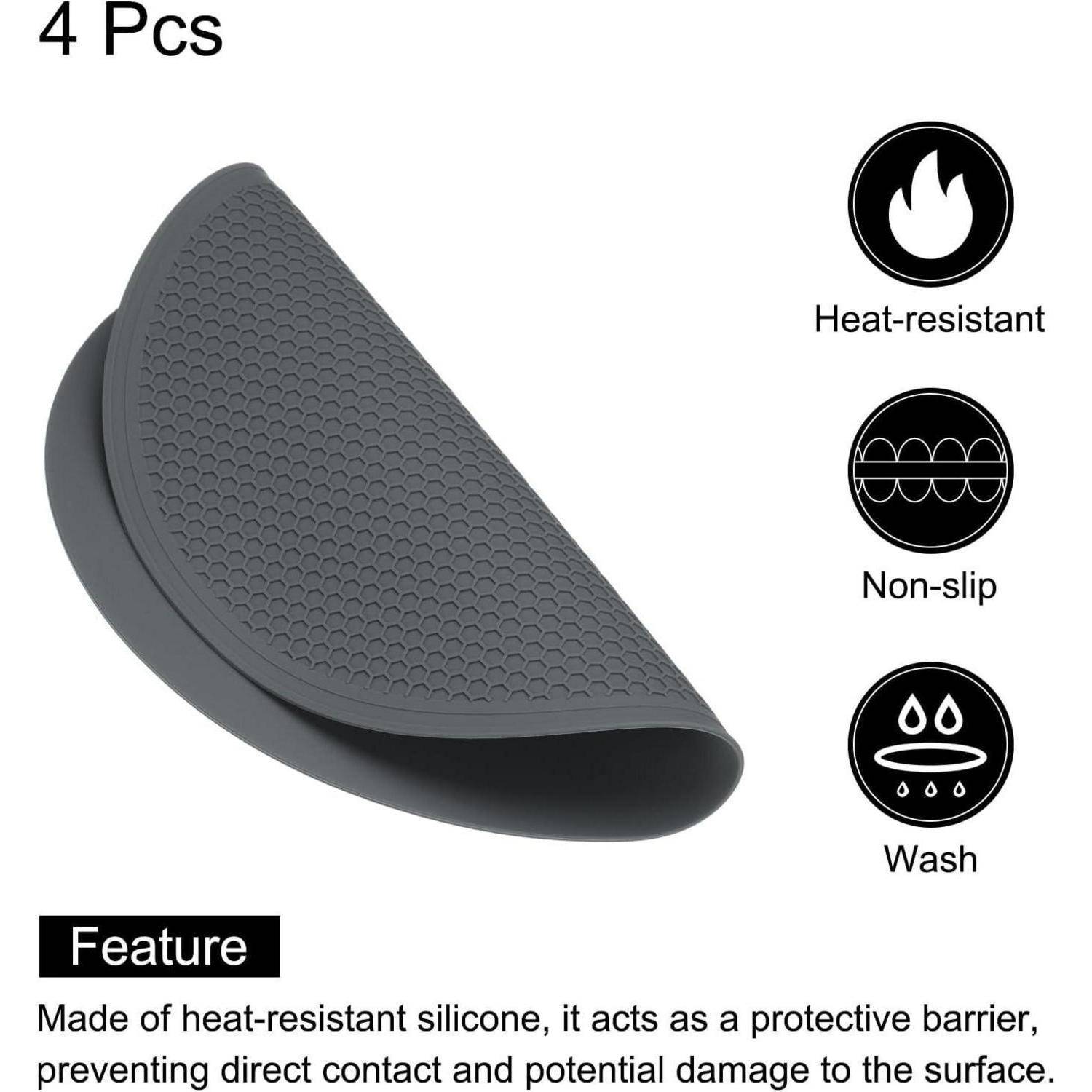 Graue Silikon-Topflappen-Handschuhe, gefaltet dargestellt, mit der Beschriftung 4er Pack; mit hitzebeständig, rutschfest und waschbar.