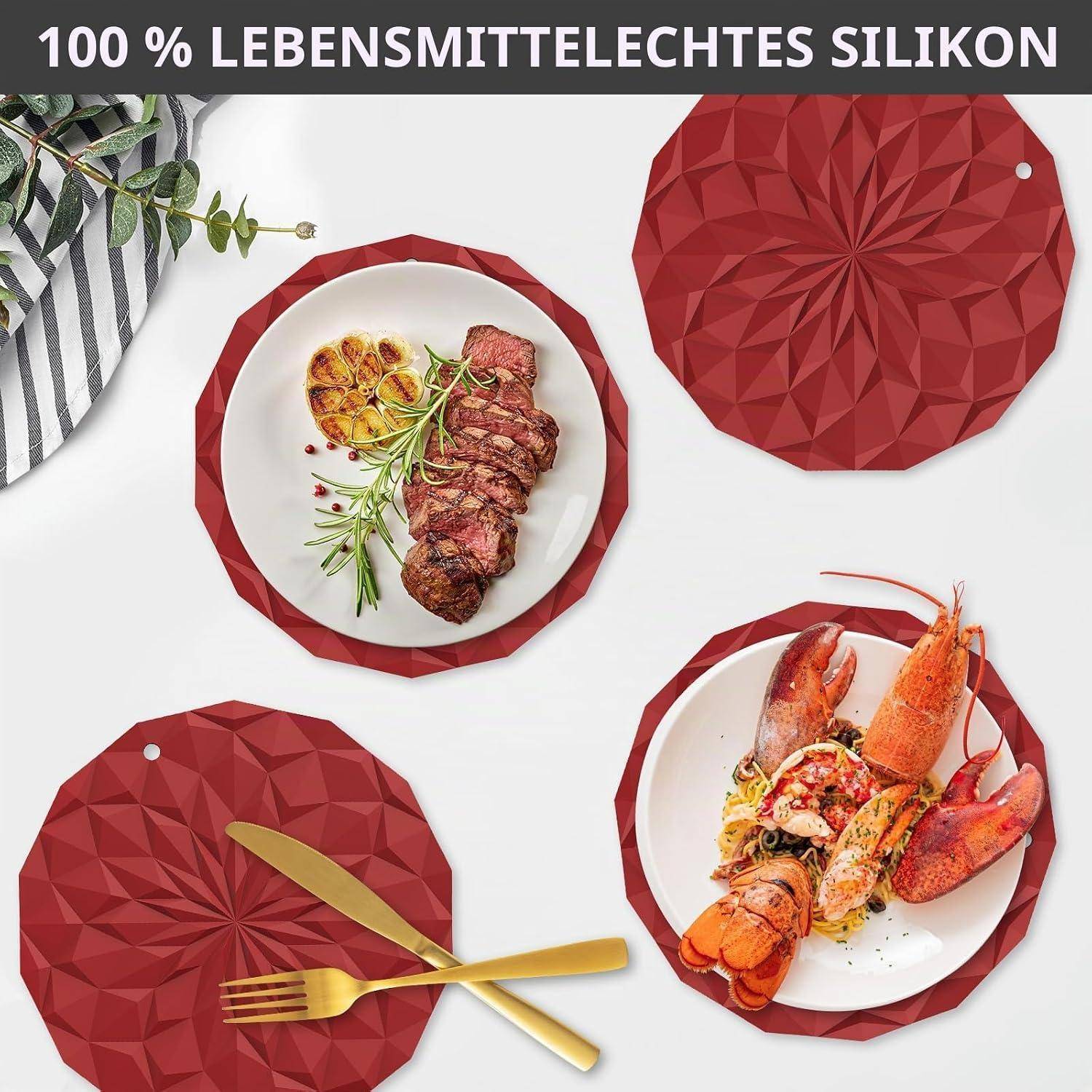 Produktabbildung von roten geometrischen Silikon-Platzdeckchen und Untersetzer mit Tellern von Steak und Hummer; Text lautet „100 % LEBENSMITTELECHTES SILIKON
