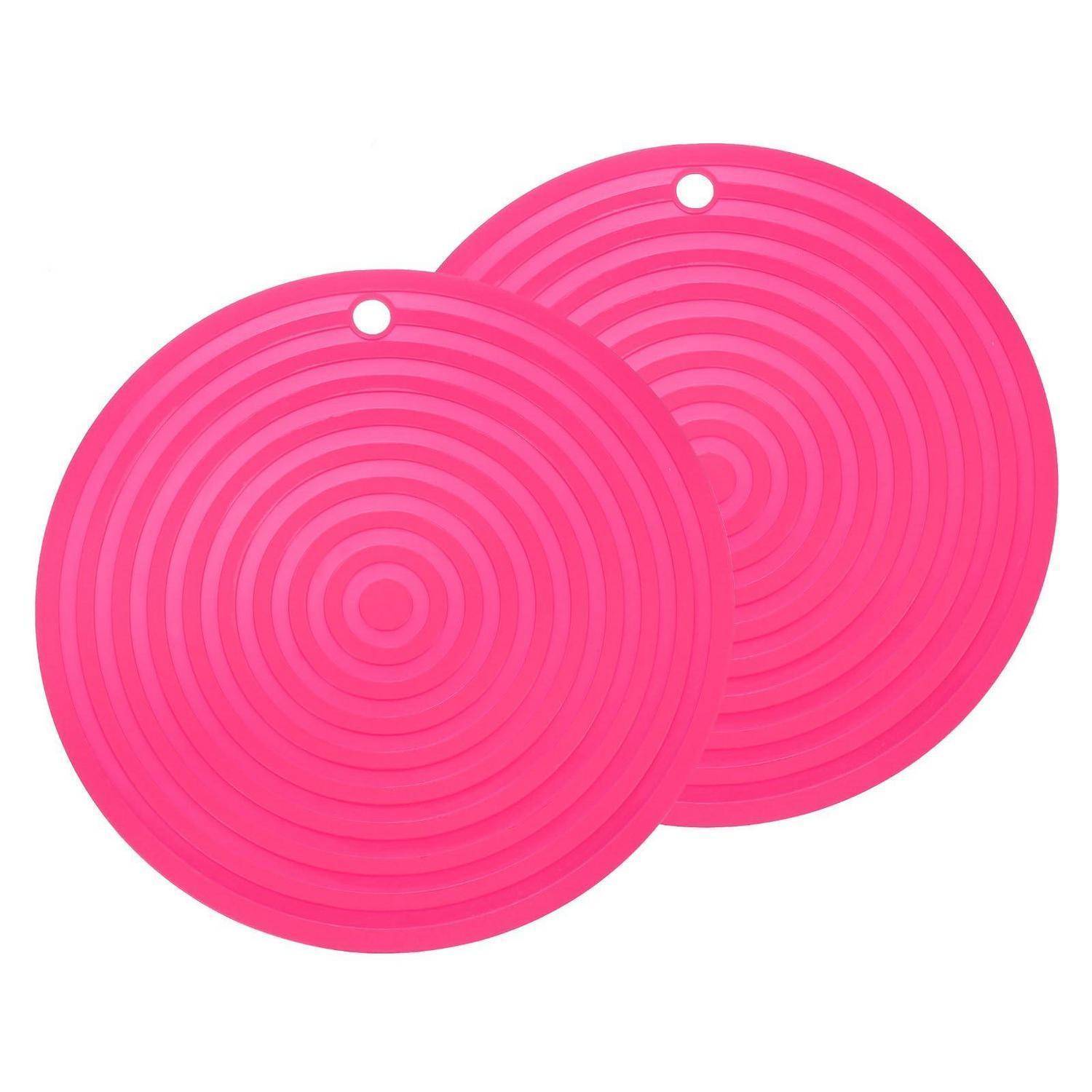 Zwei überlappende, leuchtend rosa runde Silikonmatten mit kleinen Aufhängelöchern, gezeigt auf weißem Hintergrund.