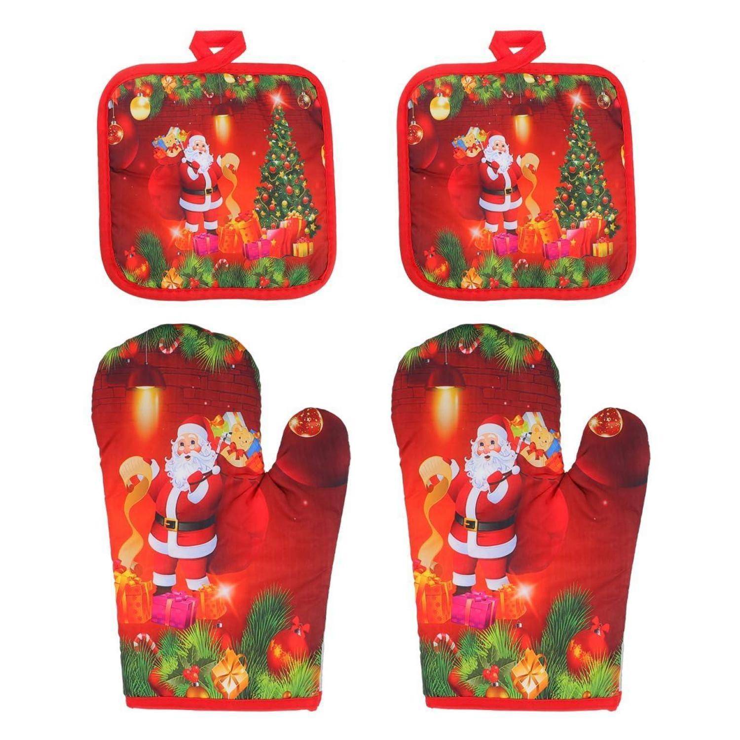 Satz aus zwei roten Weihnachtstellern und zwei passenden Ofenhandschuhen, verziert mit dem Weihnachtsmann, einem Weihnachtsbaum und weihnachtlichen Geschenken.