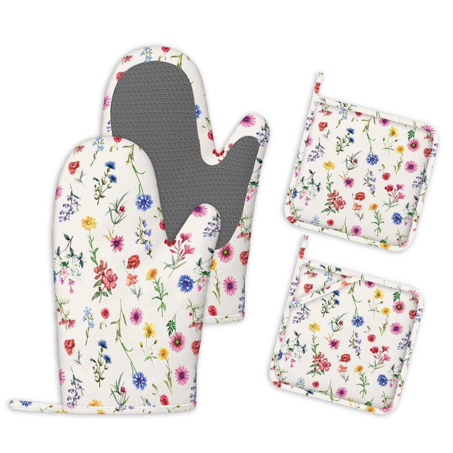 Ofenhandschuh mit Blumenmuster und zwei passende Topflappen auf weißem Hintergrund.