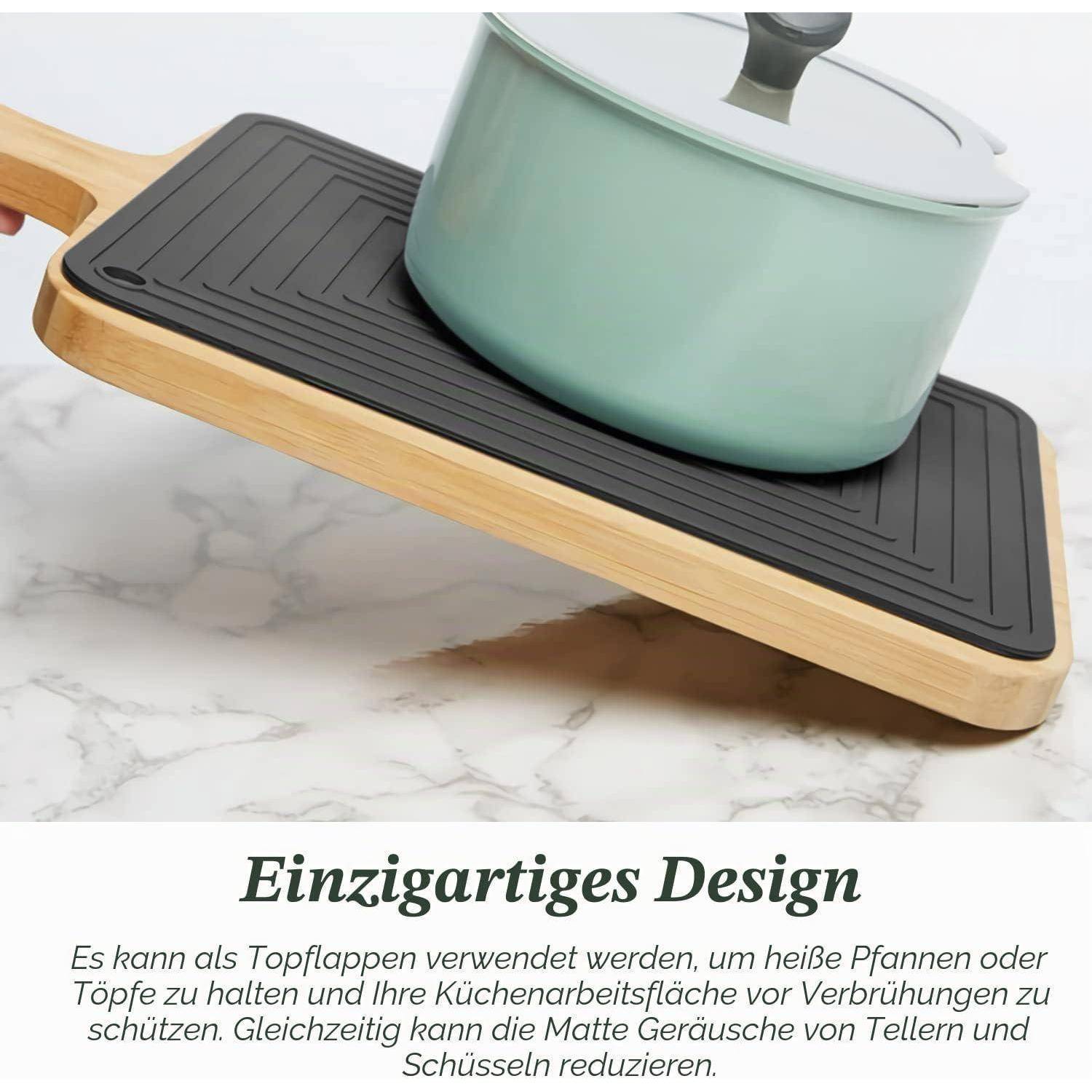 Holztablett mit schwarzer rutschfester Matte und mintgrünem Topf; der Text darunter besagt „Einzigartiges Design