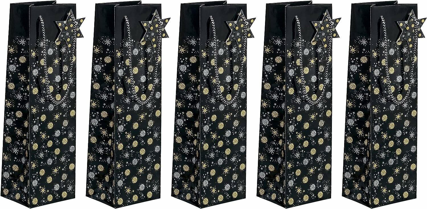 Fünf schwarze Geschenktüten mit goldenen Stern- und Mondmustern, nebeneinander auf weißem Hintergrund angeordnet.