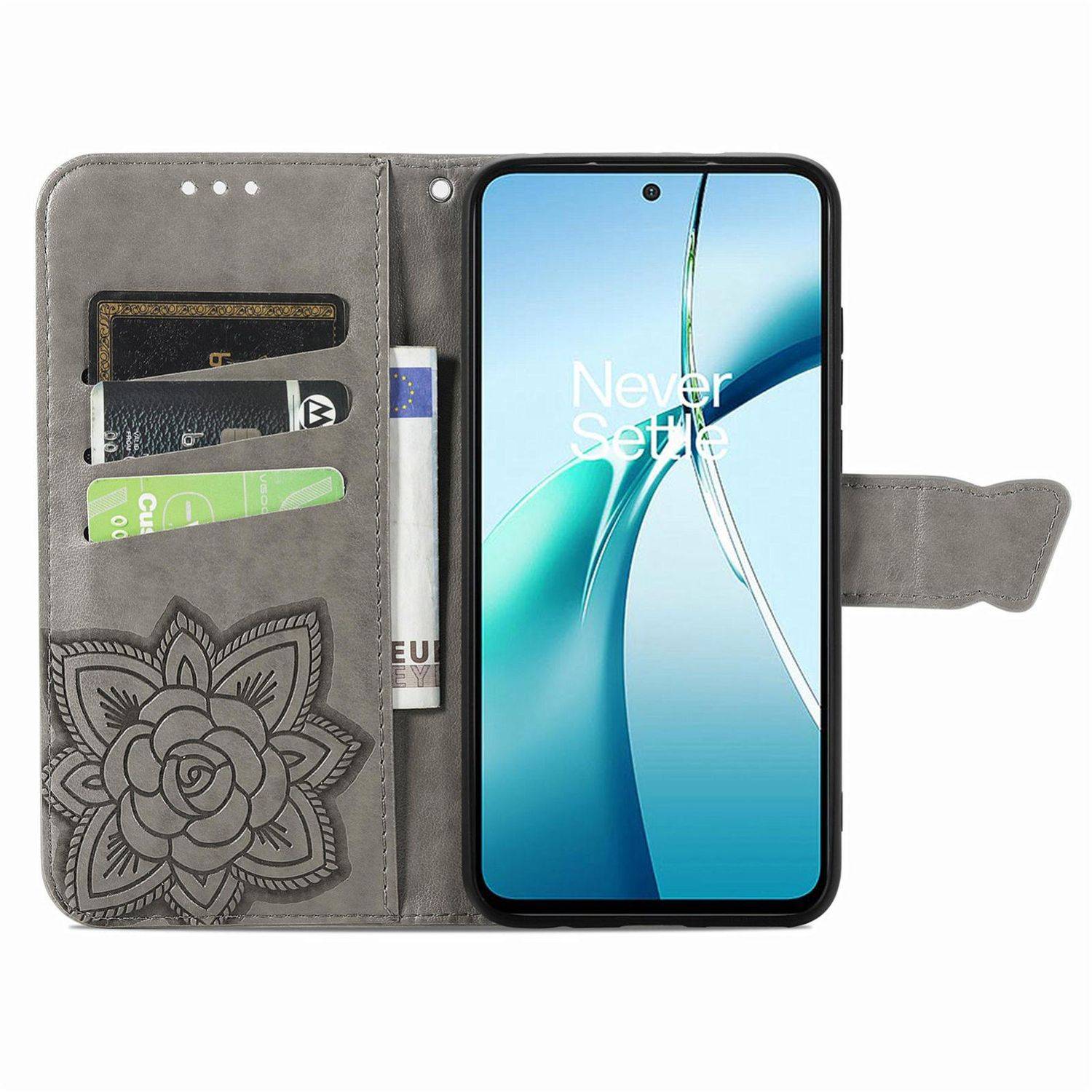 Smartphone in einem grauen Blumenmuster-Geldbörsen-Etui, auf dem Bildschirm 