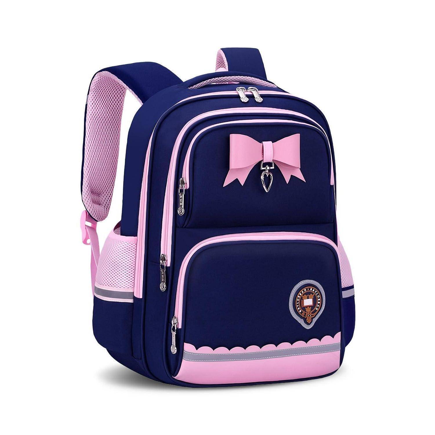 Marineblauer und rosa Kinderrucksack mit Schleifendetail, mehreren Reißverschlusstaschen und gepolsterten Schultergurten auf weißem Hintergrund.