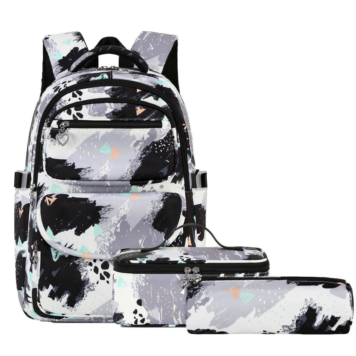 Abstrakter Rucksack in Schwarz, Weiß und Grau mit passender Lunchbox mit Reißverschluss und Federmäppchen auf weißem Hintergrund.