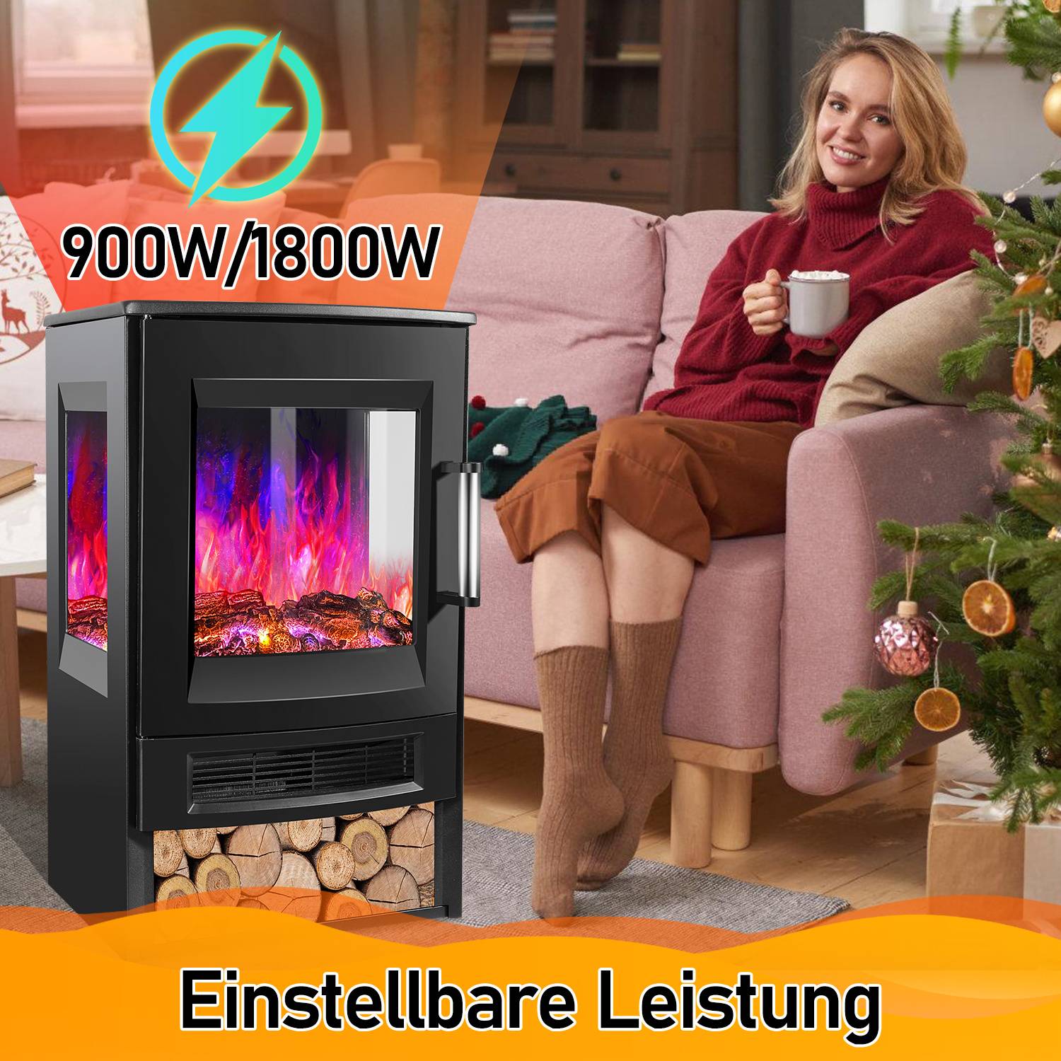 Eine Frau sitzt auf einem Sofa und hält eine Tasse neben einem schwarzen elektrischen Kaminheizer mit der Aufschrift „900W/1800W" und „Einstellbare Leistung"".