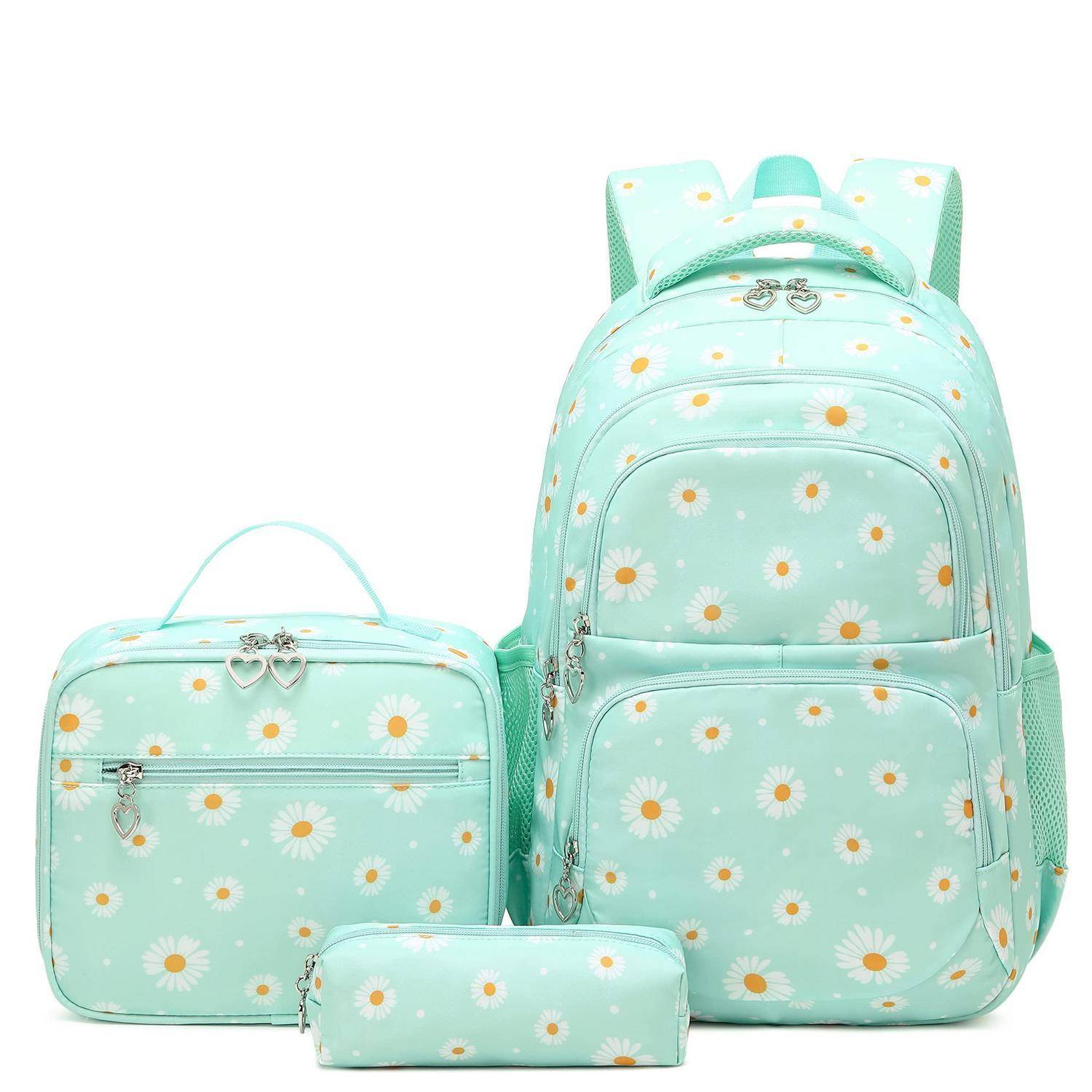 Mintgrüner Rucksack mit Gänseblümchenmuster, Lunchbox und Federtasche im Set auf weißem Hintergrund.