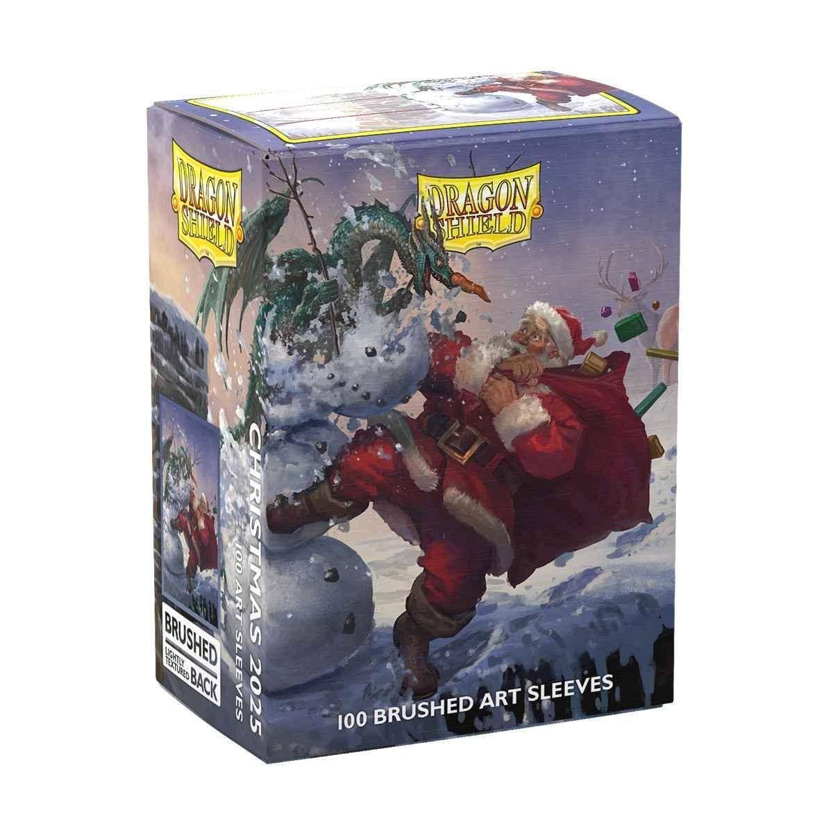 Schachtel mit Dragon Shield 100 gebürsteten Art Sleeves mit Motiv eines Weihnachtsmanns auf einem Drachen in einer verschneiten Szene.