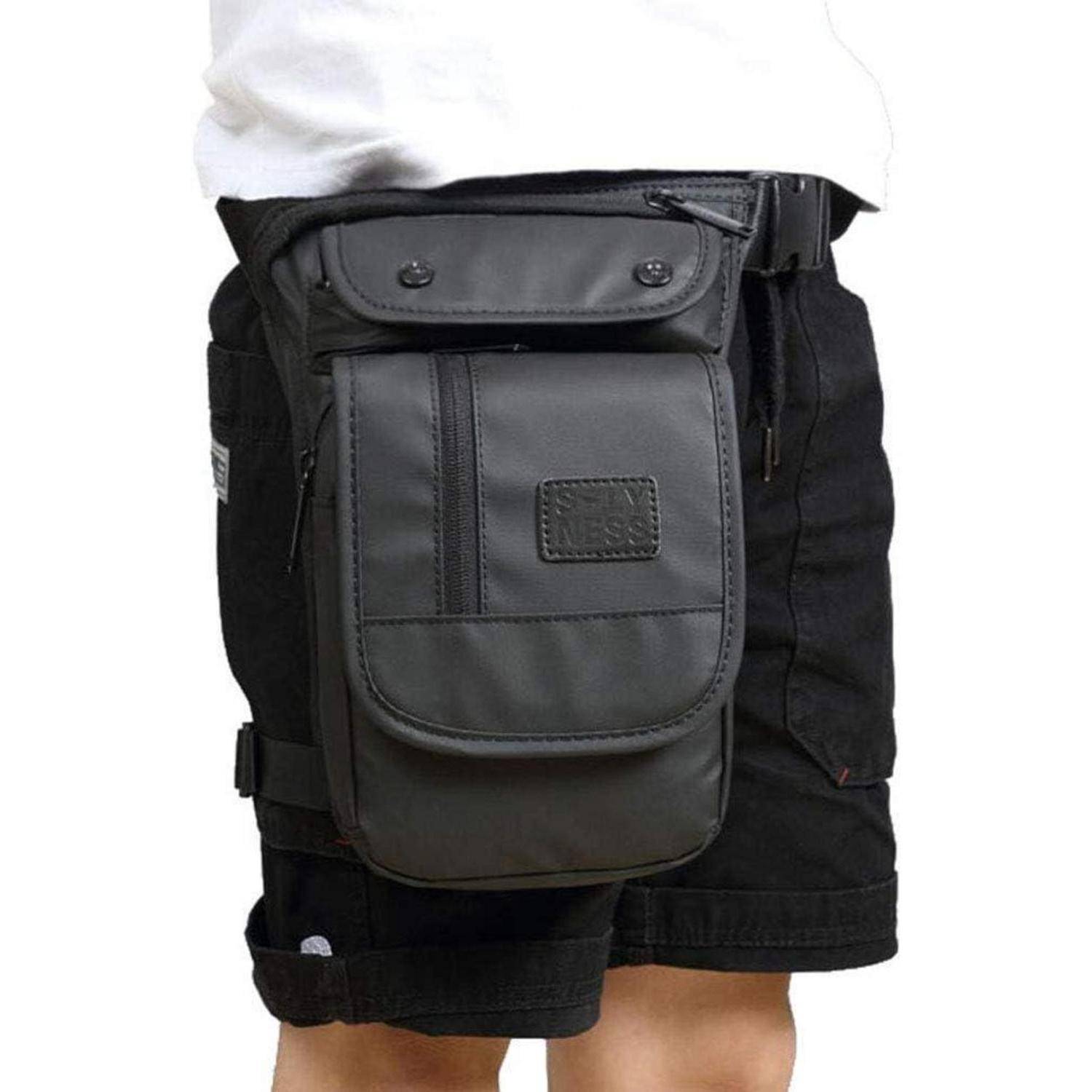 Schwarze Oberschenkelholster-Tasche, die über Shorts getragen wird, mit mehreren vorderen Taschen und verstellbaren Riemen.