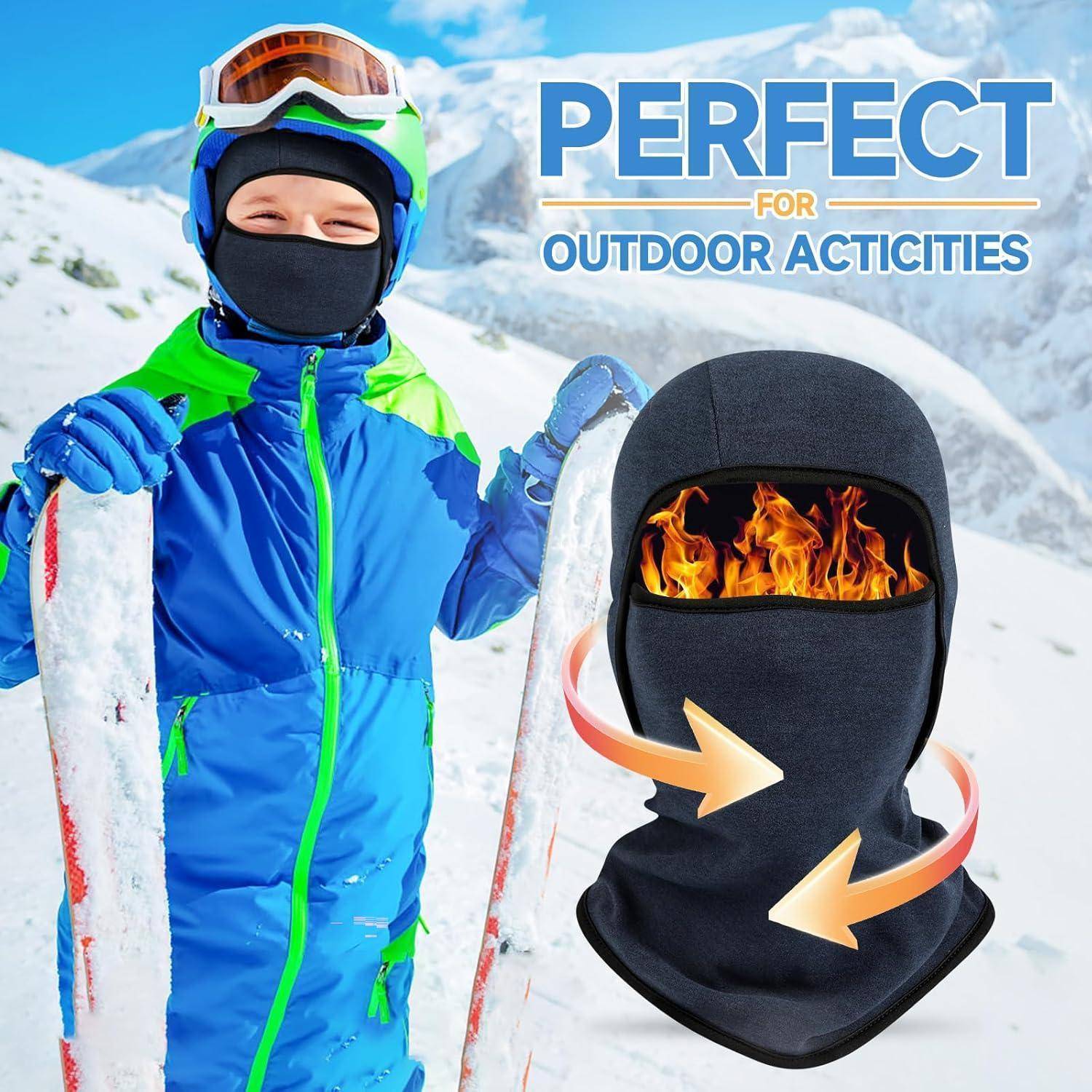 Kind in blauem Skizug hält Skier an einem schneebedeckten Hang neben einer beheizten Sturmhaube-Grafik, mit dem Text „PERFEKT FÜR OUTDOOR-AKTIVITÄTEN IN DER ARKTIS".