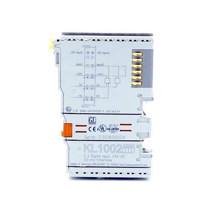 Weißes industrielles elektronisches Modul mit Schaltplan und vergoldeten Anschlussleisten, gekennzeichnet mit KL 1002 und 24V DC.
