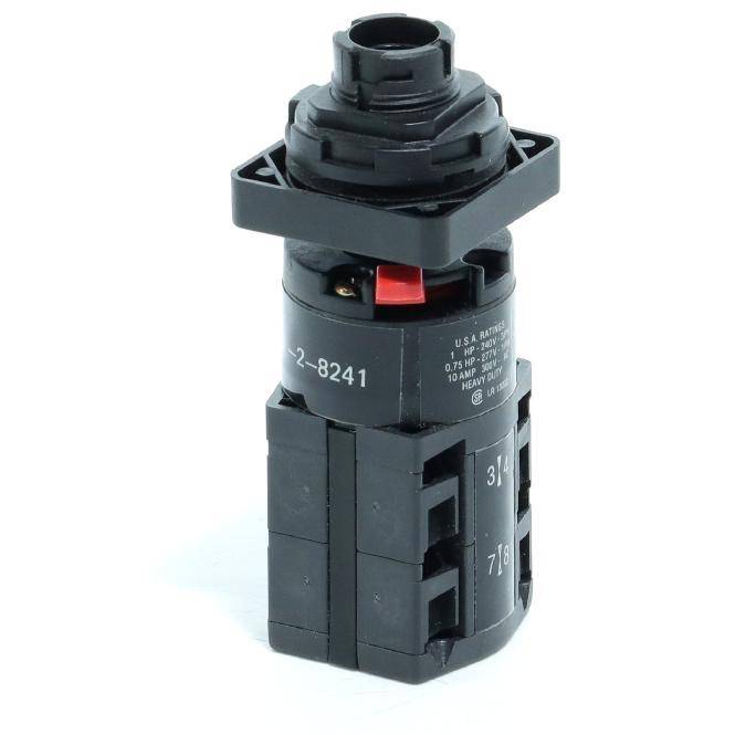 Schwarze elektrische Schalter- oder Wahlschalter-Komponente mit roter Verriegelungslasche, isoliert auf weißem Hintergrund dargestellt.