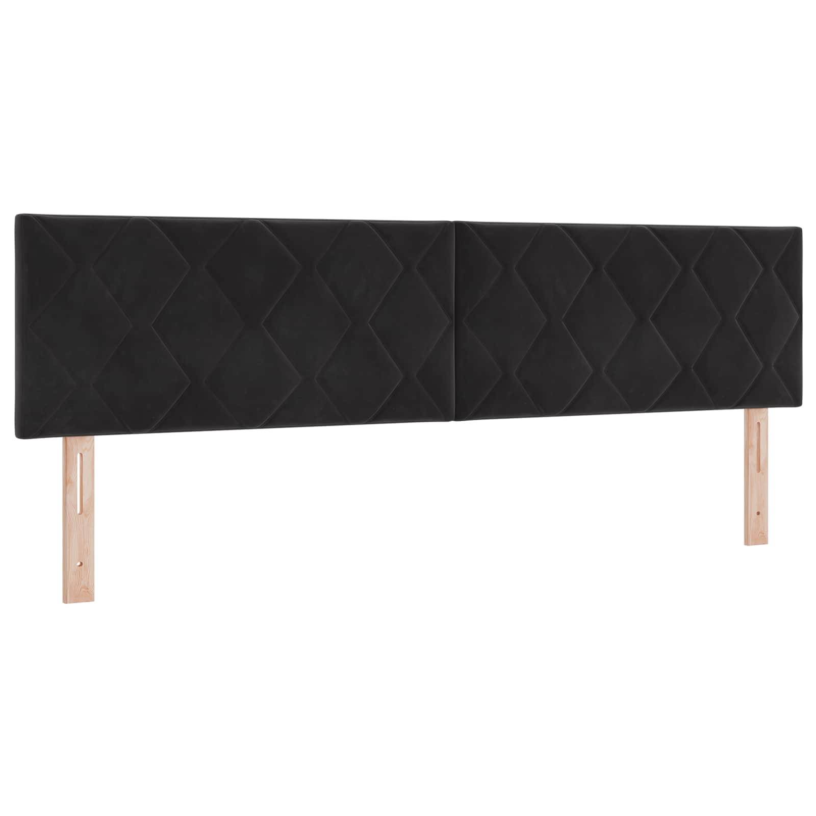 Schwarz gepolstertes, an der Wand montiertes Kopfbrett mit Rautensteppung und zwei hellholzfarbenen Stützbeinen.