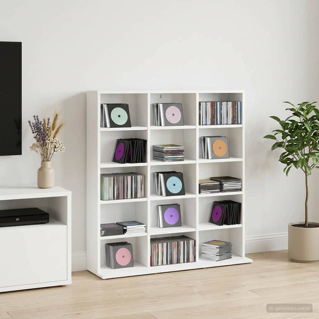 Weiße Kubus-Regale voller Schallplatten und CDs in einem minimalistischen Wohnzimmer, flankiert von einer TV-Kommode mit Vase und einem Topfbaum.