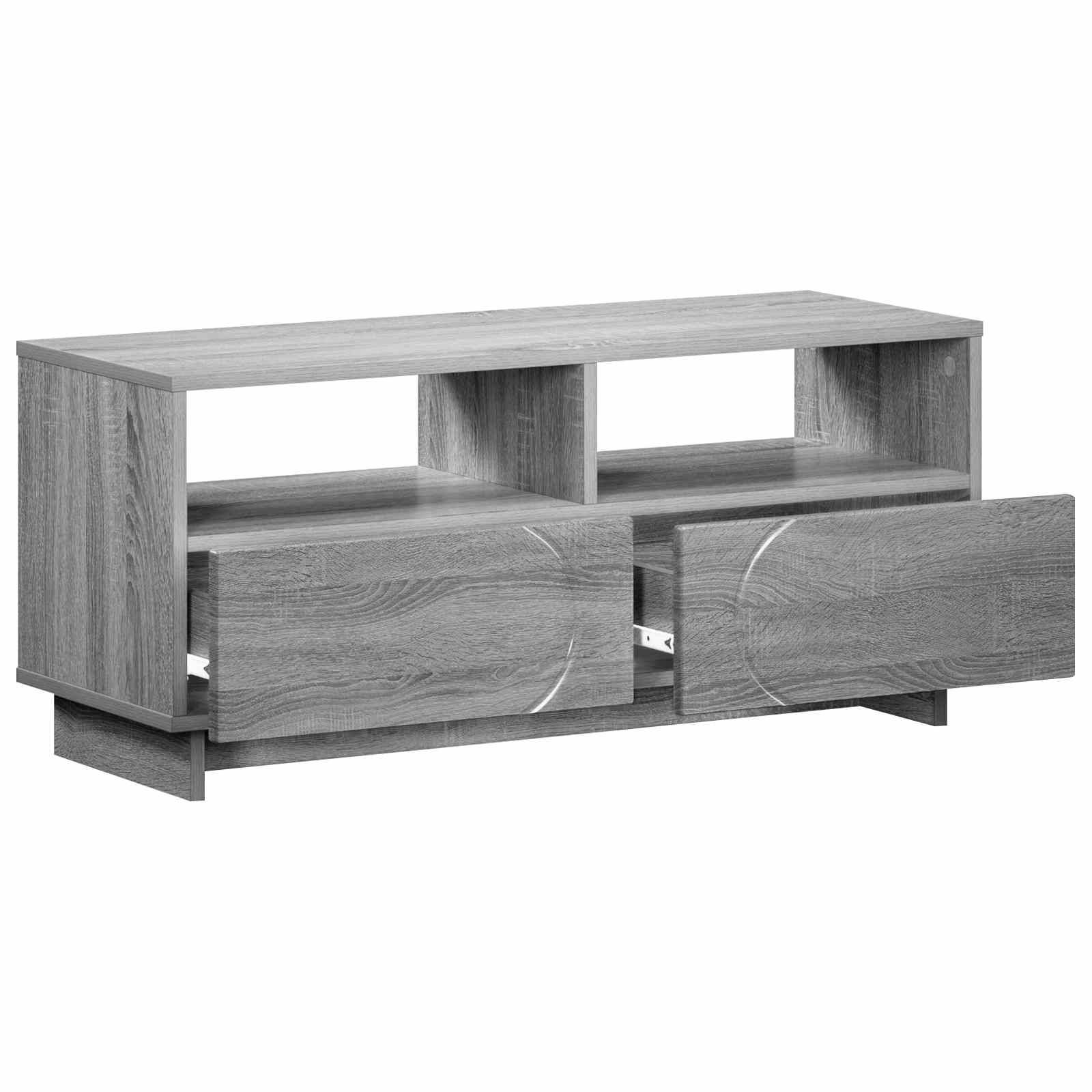 Grauer Holz-Fernsehständer mit zwei offenen Regalen und zwei geöffneten vorderen Schubladen, auf weißem Hintergrund abgebildet.