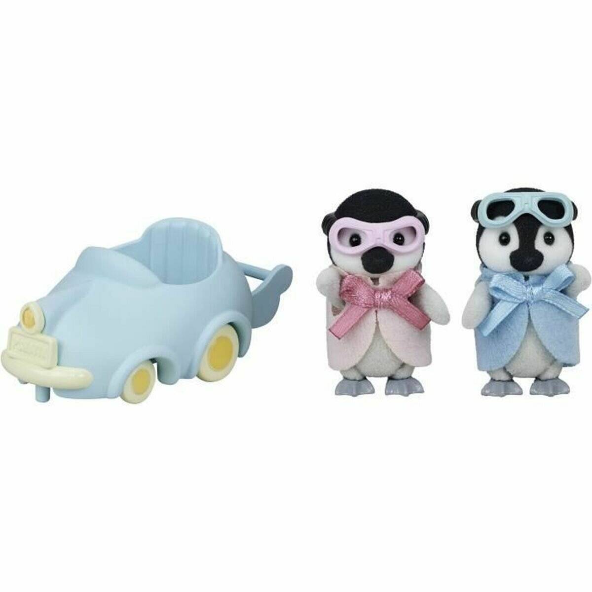 Ein hellblaues Spielzeugauto neben zwei Pinguinfiguren mit Schutzbrille und Schleifen, eine rosa und eine blau.