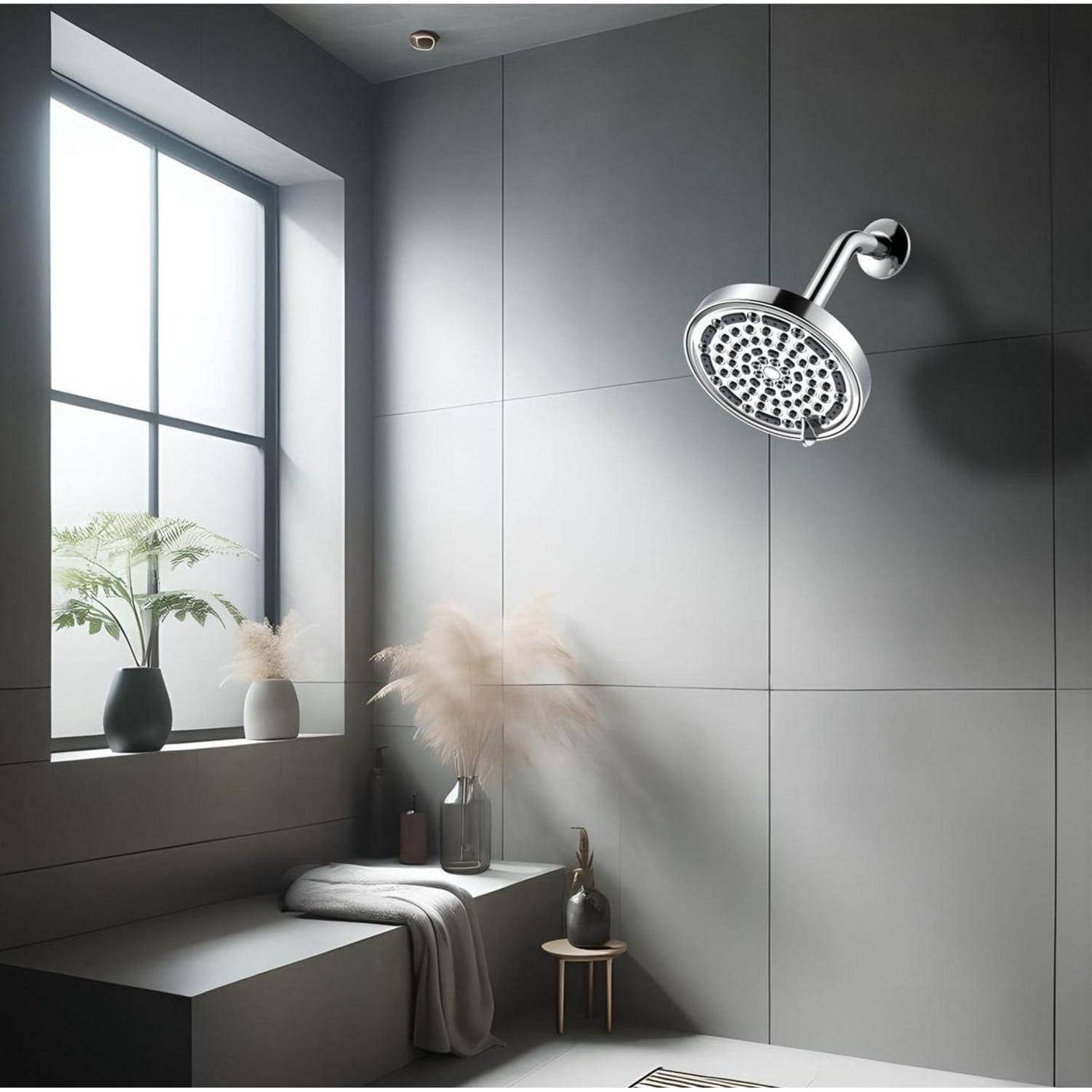 Modernes graues Badezimmer mit einer wandmontierten Regendusche, großem Fenster und minimalistischer Einrichtung neben einer eingebauten Bank.