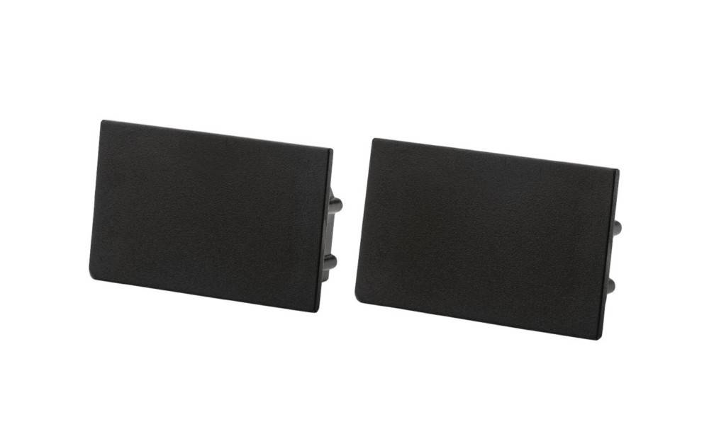 Zwei schwarze rechteckige Kunststoff-Elektrosteckdosen-Wandplatten oder -Abdeckungen, die nebeneinander auf weißem Hintergrund gezeigt werden.