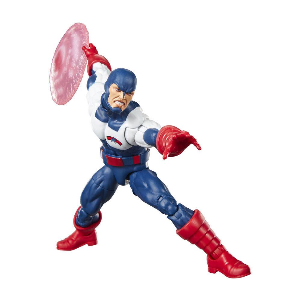 Eine blau-rot gekleidete Actionfigur posiert dynamisch mit einem erhobenen Arm, der ein durchsichtiges rosa Schild hält, und dem anderen Arm nach vorne ausgestreckt.