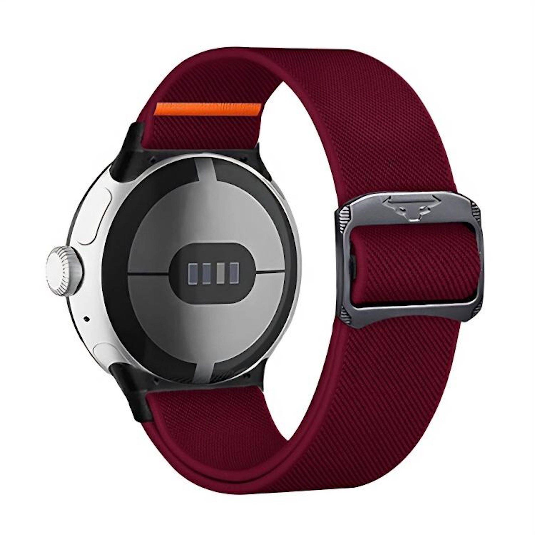 Rückansicht einer Smartwatch mit burgunderfarbenem Stoffarmband und sichtbaren Ladekontakten auf dem runden silbernen Gehäuse.