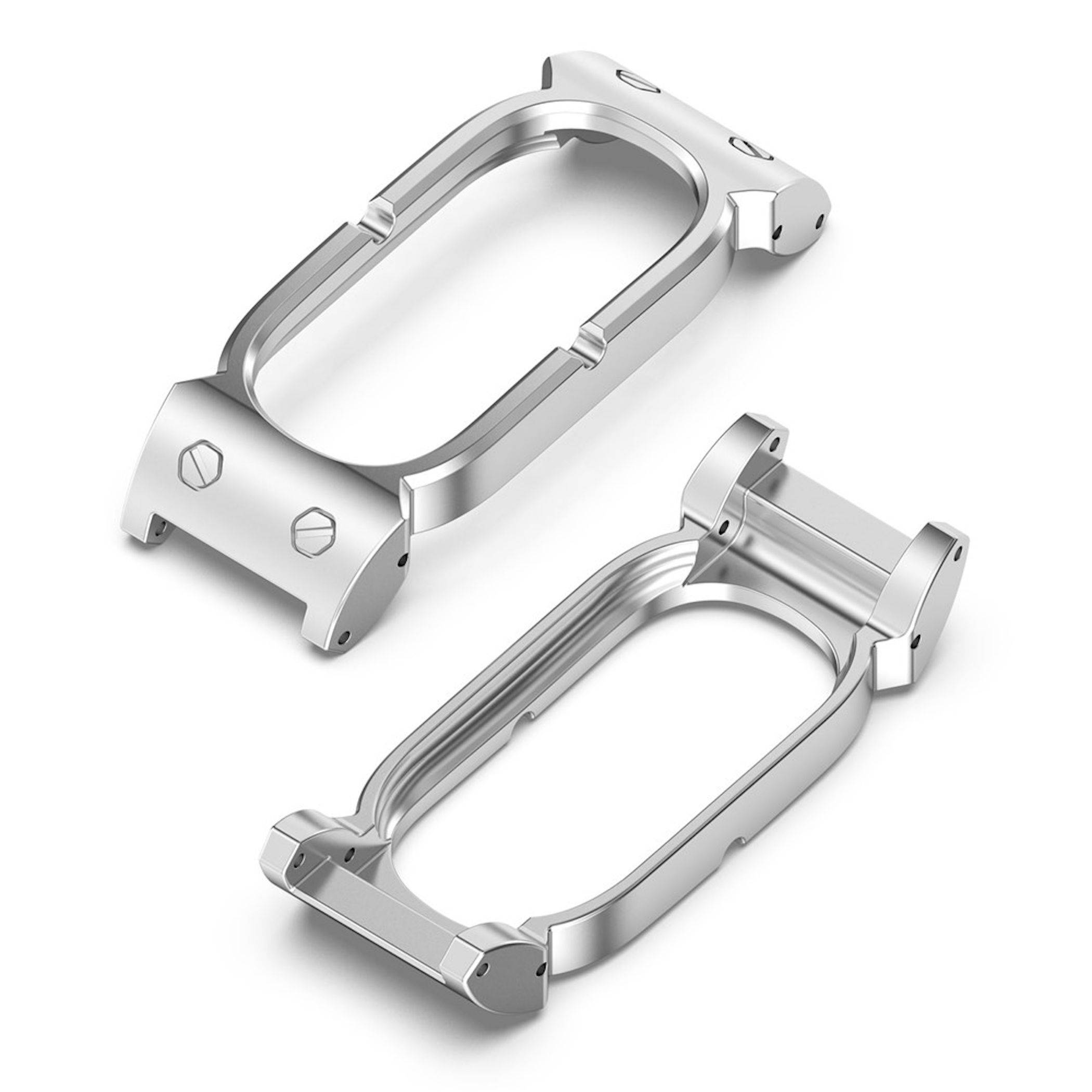 Zwei silberne Metallgehäuserahmen für Uhren, die in einer produktstilisierten Darstellung diagonal auf weißem Hintergrund präsentiert werden.
