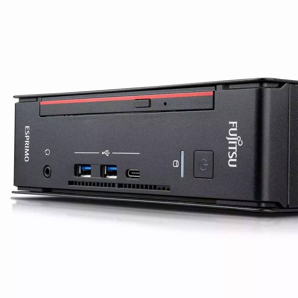 Fujitsu ESPRIMO kleiner Desktop-PC auf weißem Hintergrund gezeigt, mit sichtbarem Stromschalter an der Vorderseite, USB-Anschlüssen, Kopfhöreranschluss und Laufwerksschacht.