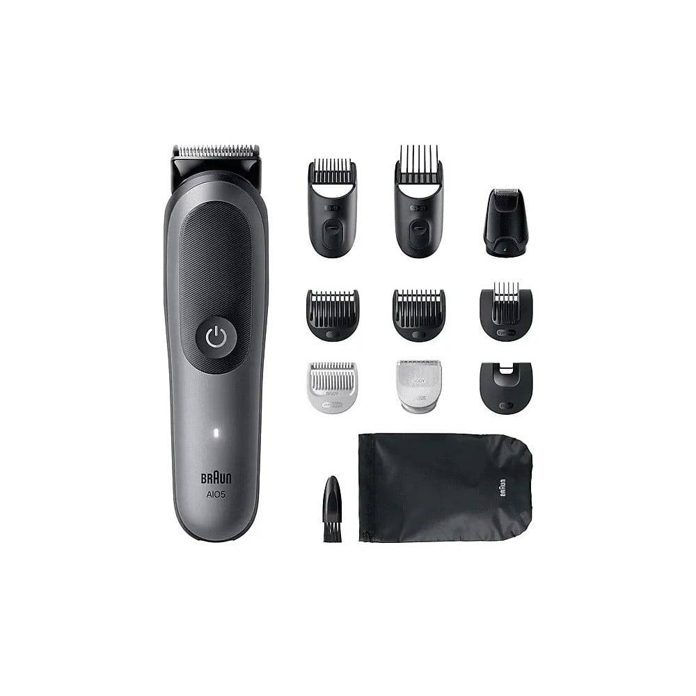 Braun A1005 elektrischer Trimmer mit mehreren Schneidekopfsätzen, Präzisions-Aufsätzen, Ladekabel und Aufbewahrungstasche auf weißem Hintergrund.