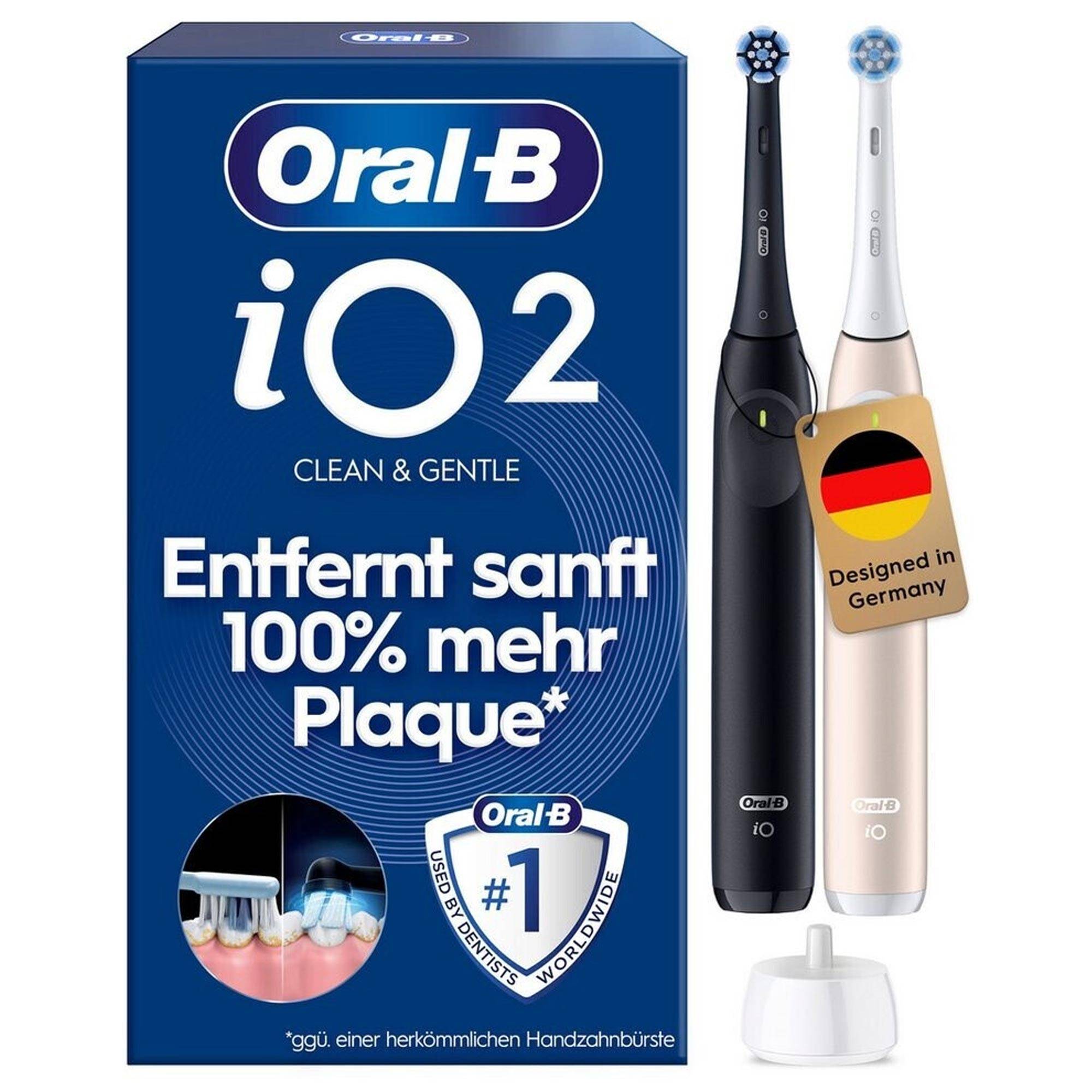 Oral-B iO 2 Elektrische Zahnbürste Verpackung mit zwei Zahnbürsten, einem Ladegerät und deutschem Text mit der Aussage „entfernt 100% mehr Zahnbelag