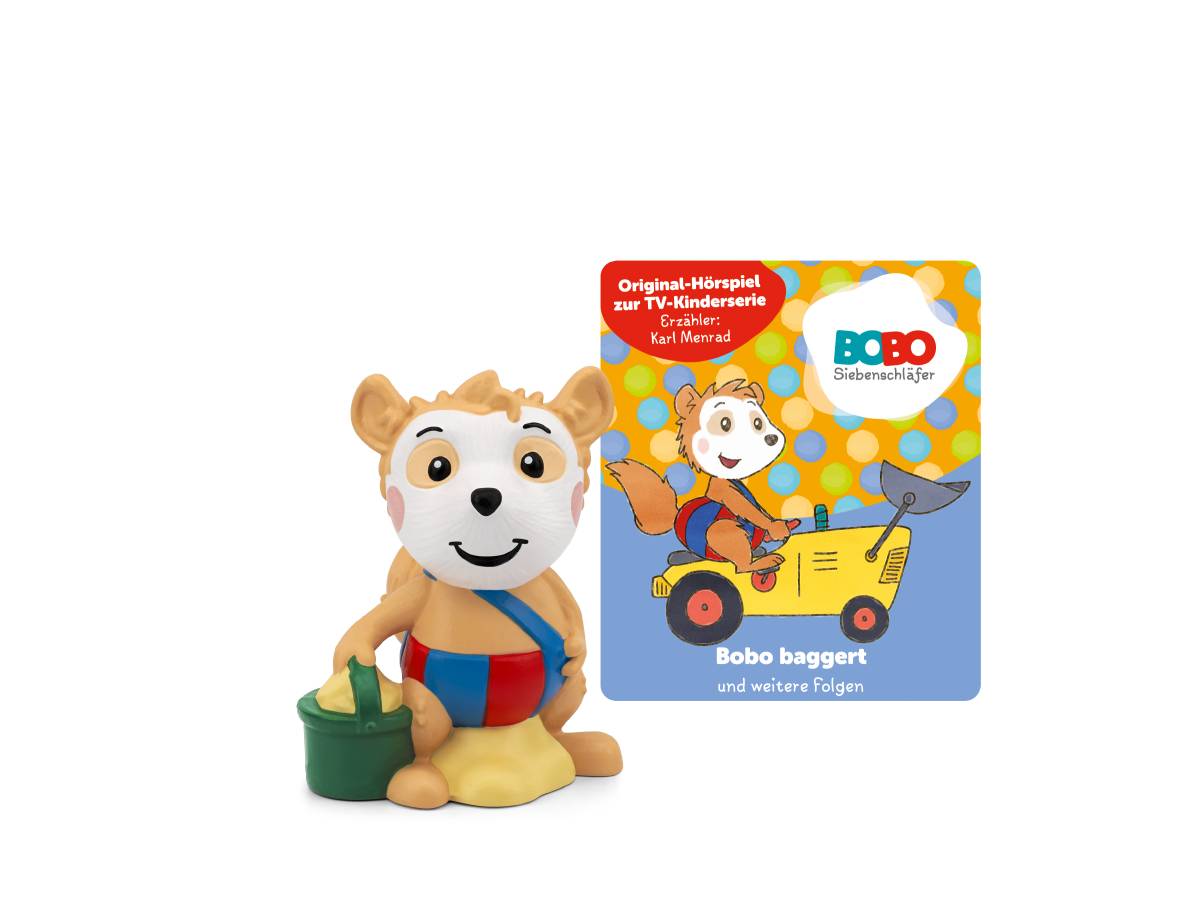 Bobo die Puppe sitzt neben einem Buchcover von „Bobo Siebenschläfer