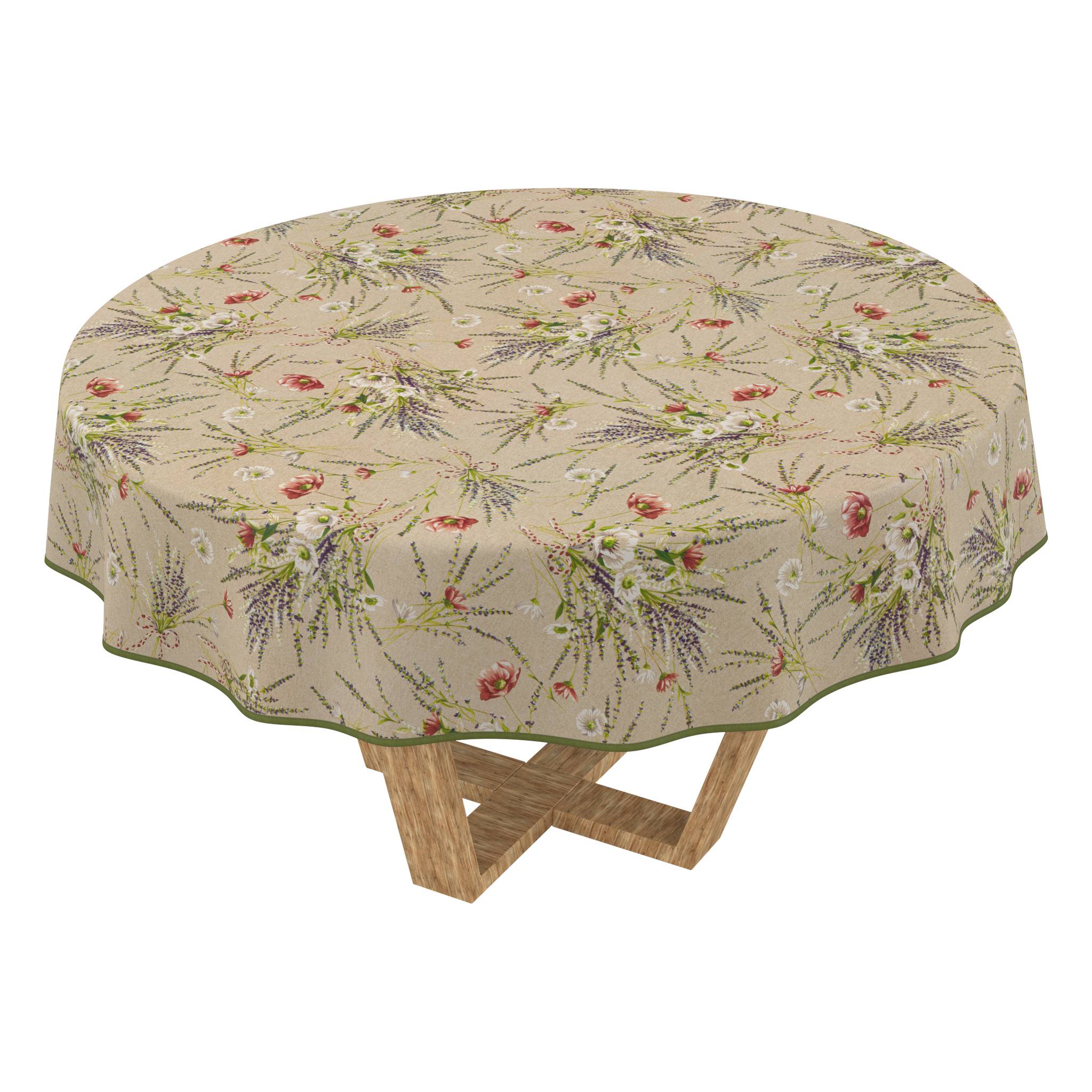 Runder Tisch mit beigefarbiger Blumen-Tischdecke, darunter hölzerne X-förmige Beine sichtbar.