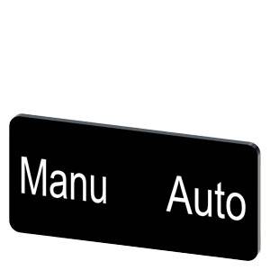 Schwarzer Knopf mit den Beschriftungen „Manu