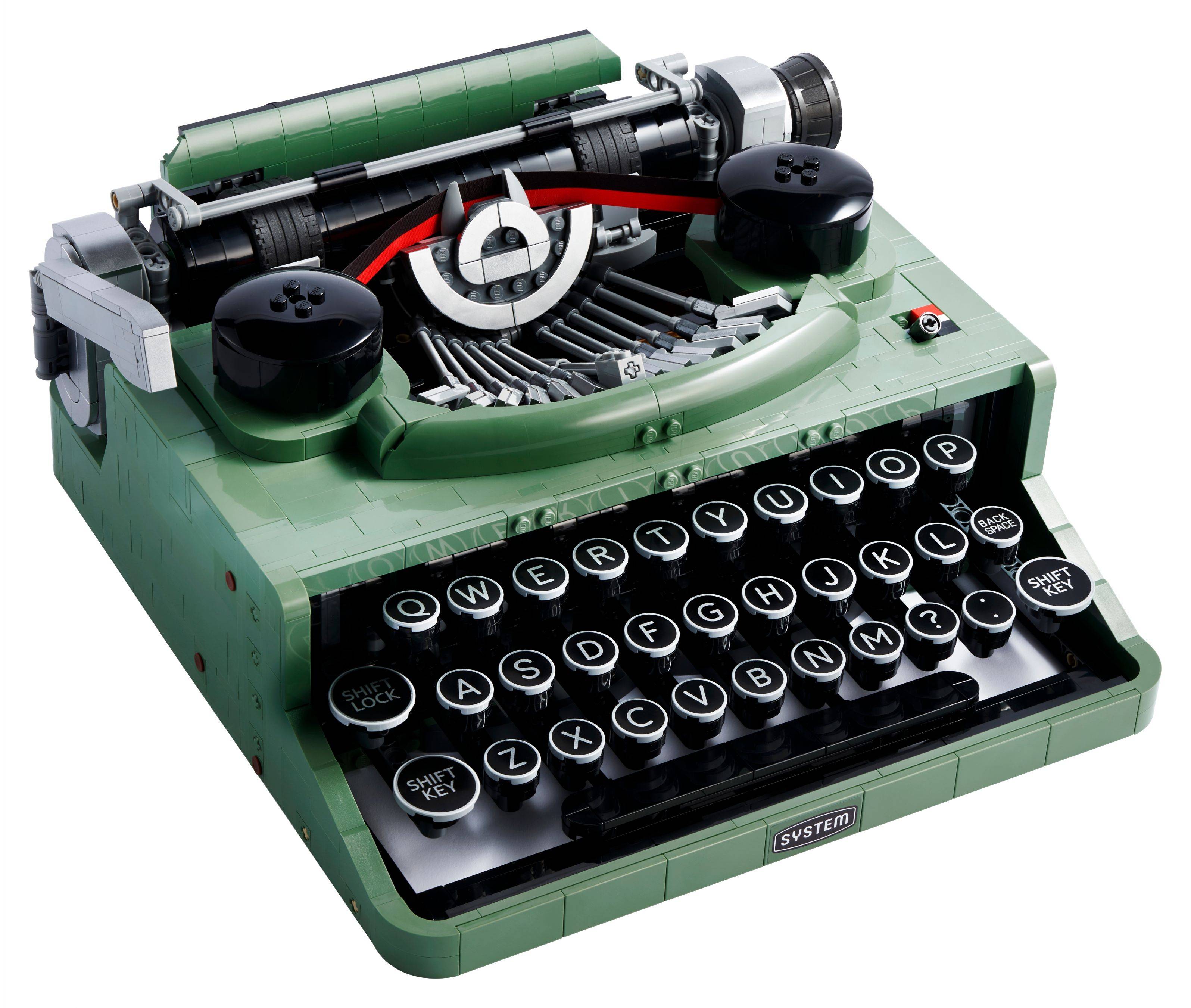 Vintage grüne manuelle Schreibmaschine mit runden schwarzen Tasten und sichtbarem Bandmechanismus, auf weißem Hintergrund dargestellt.